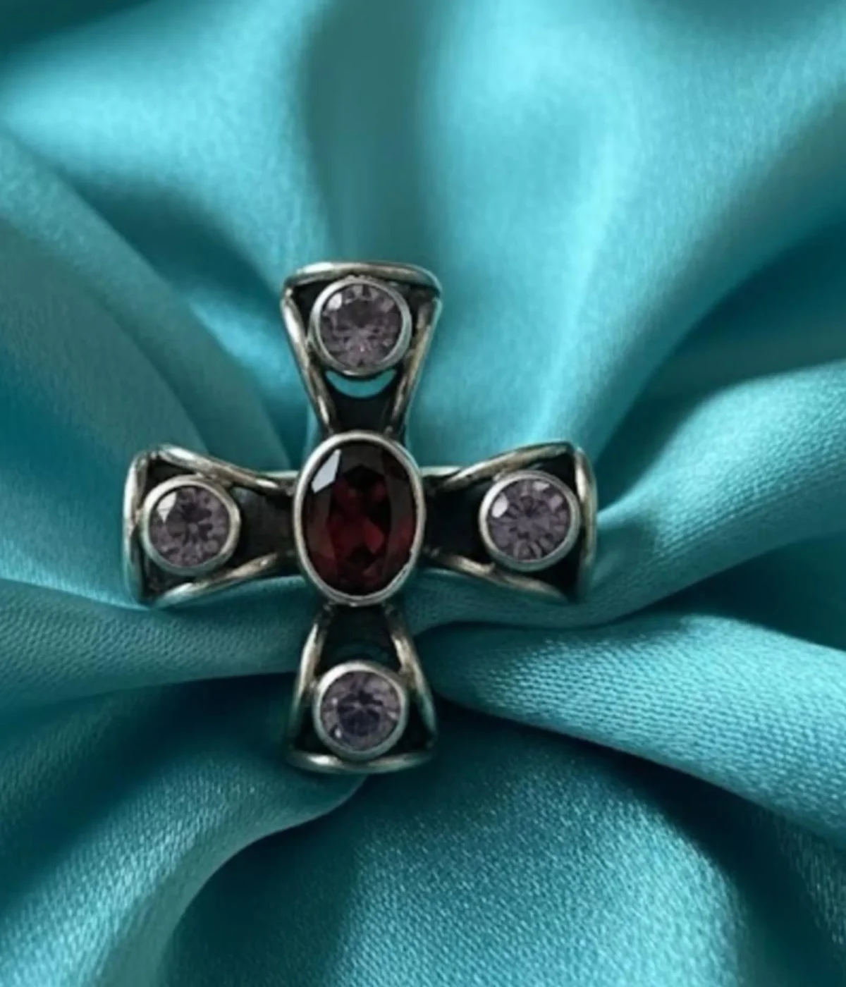 Sterling Silver Cross Statement Ring. Antique-style design featuring a central Garnet-style red oval gem and four surrounding Amethyst-style purple stones. Religious and Gothic jewelry.