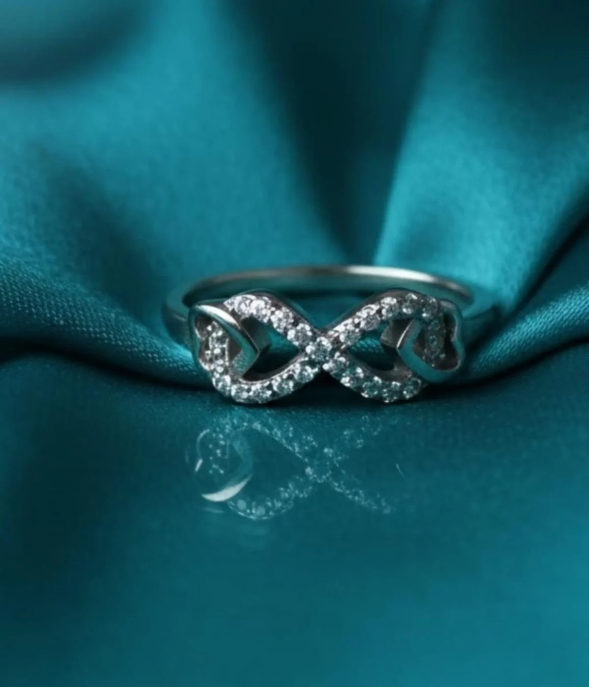 Sterling Silver Infinity Ring. Elegant Pave CZ design forming the forever love symbol (figure-eight). Dainty promise ring or everyday jewelry.