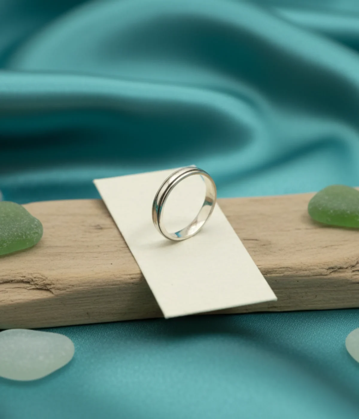 Men's Sterling Silver Minimalist Band Ring featuring a central grooved design. The polished 925 Silver ring is displayed on a white surface, suitable for everyday wear.