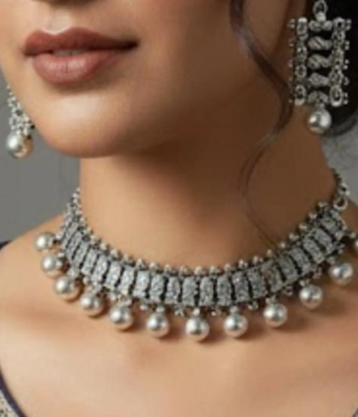 Oxidized Silver Ball Drop Necklace and Earring Set. Tribal choker with ball (Ghungroo) fringe and matching antique finish earrings, displayed on a carved wooden box.