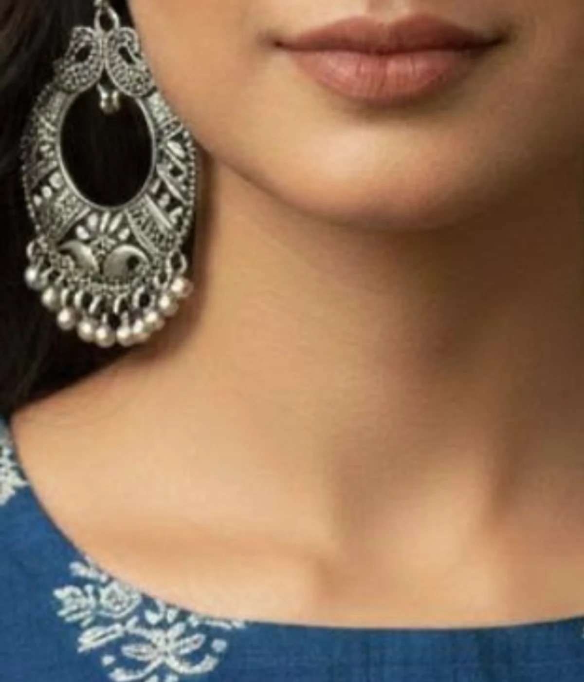 Pair of Oxidized Silver Peacock Drop Earrings. Large Traditional Chandbali Jhumka style with intricate ghungroo drops and tribal carving, displayed inside a velvet-lined wooden jewelry box.