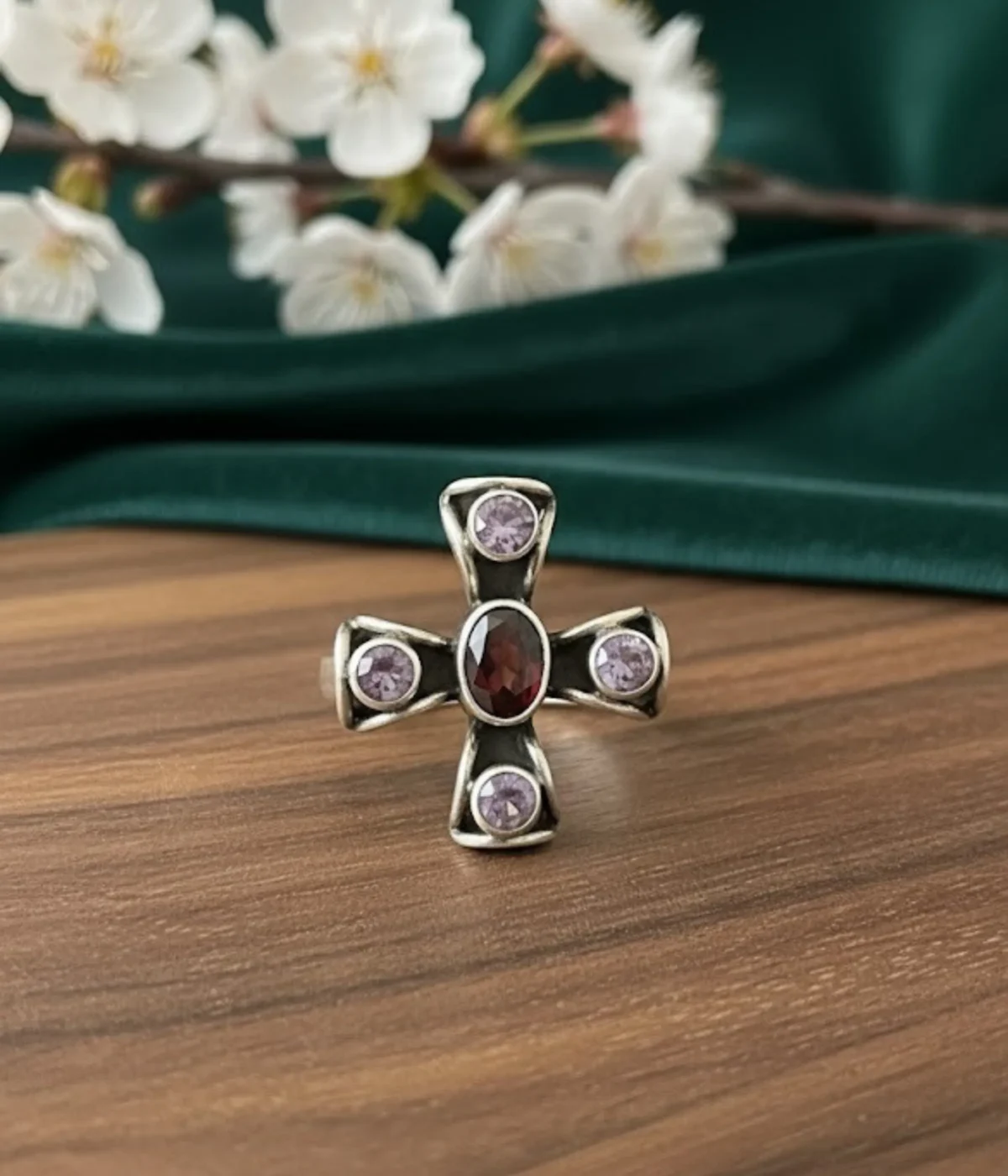 Sterling Silver Cross Statement Ring. Antique-style design featuring a central Garnet-style red oval gem and four surrounding Amethyst-style purple stones. Religious and Gothic jewelry.