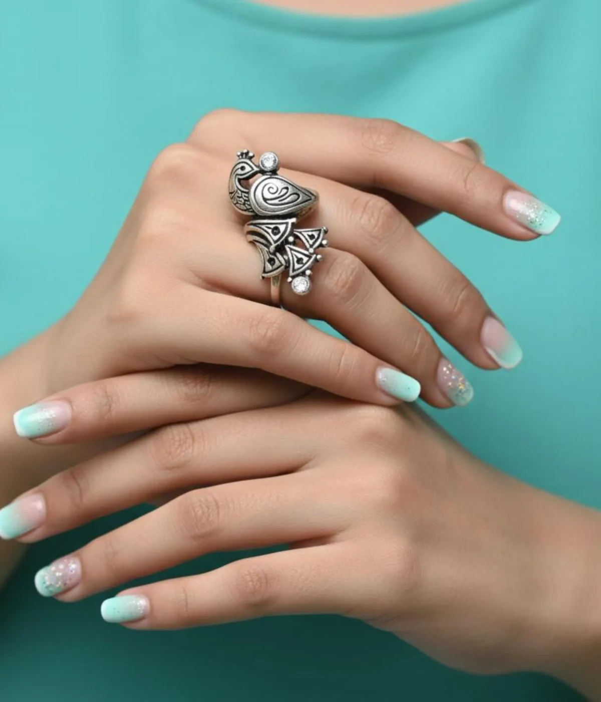 Oxidized Sterling Silver Peacock Ring. Detailed Mayur motif in an ethnic, antique tribal look design with small CZ accents. Traditional statement ring.