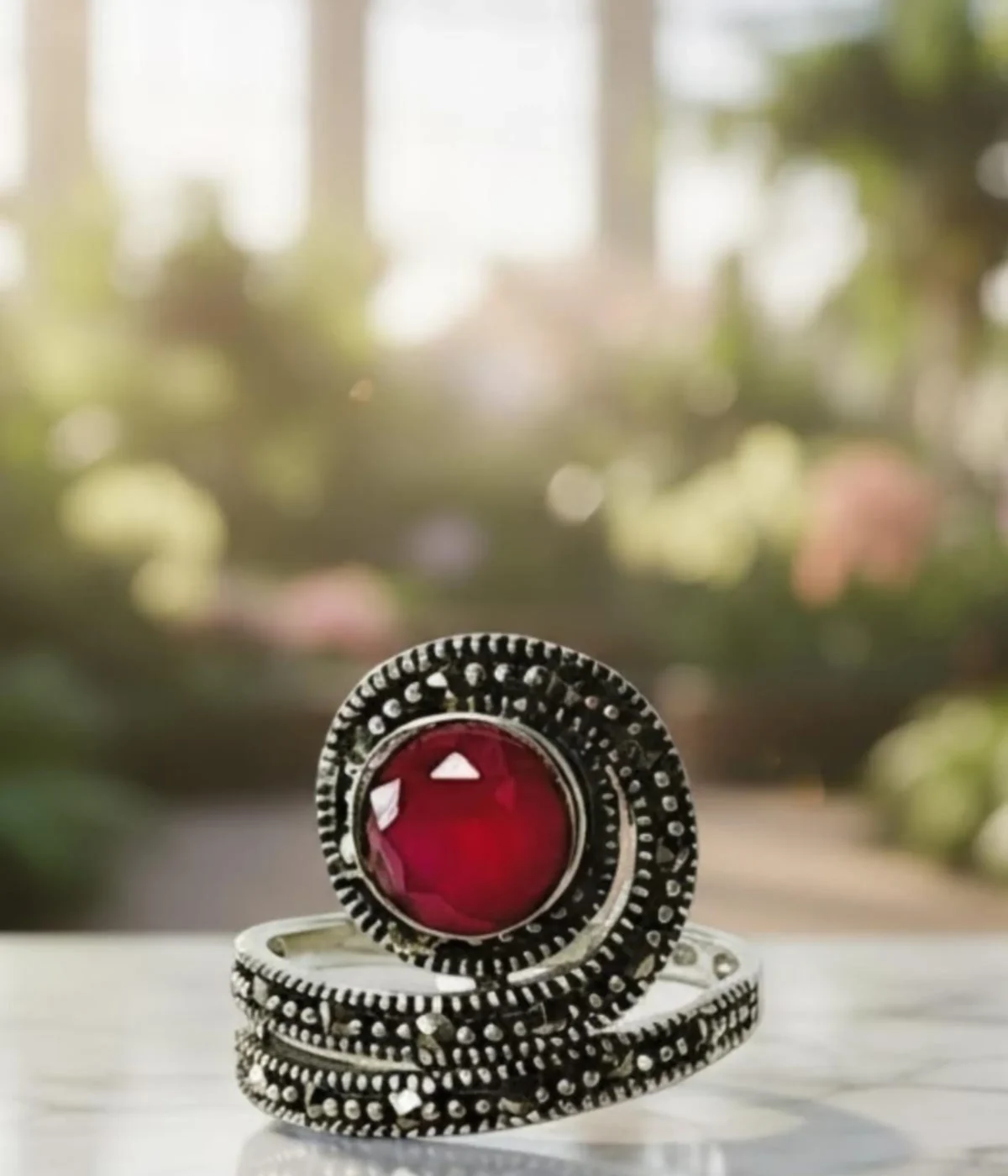 Vintage Marcasite Coil Ring. Oxidized Sterling Silver wrap ring featuring a large faceted Ruby Red center stone and detailed Marcasite accents. Antique Statement Jewelry.