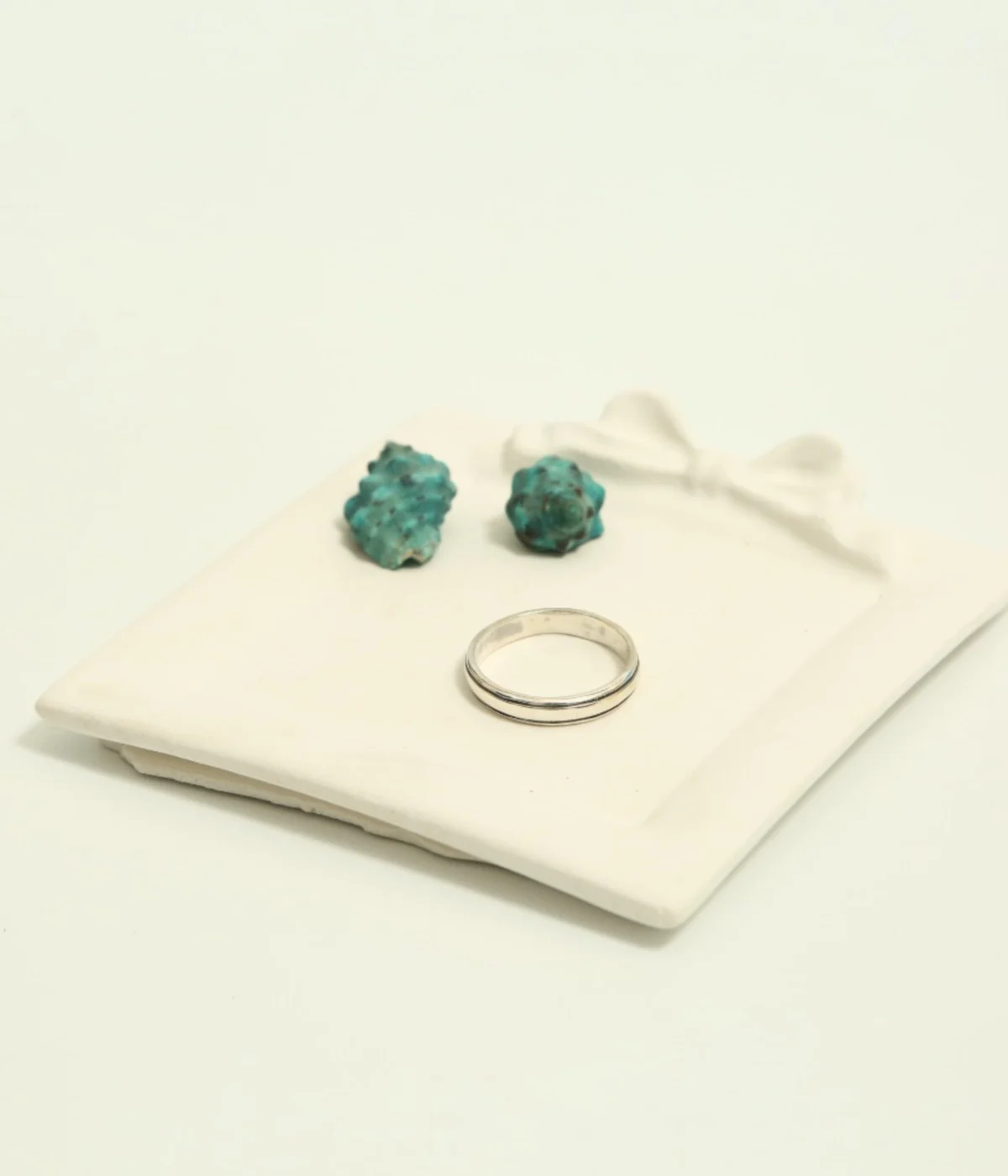 Men's Sterling Silver Minimalist Band Ring featuring a central grooved design. The polished 925 Silver ring is displayed on a white surface, suitable for everyday wear.