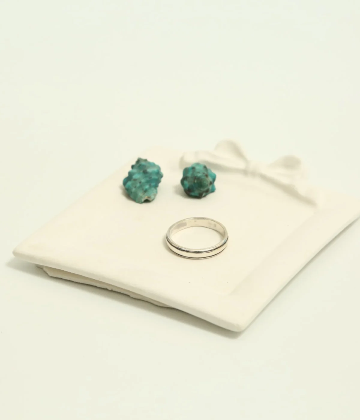 Men's Sterling Silver Minimalist Band Ring featuring a central grooved design. The polished 925 Silver ring is displayed on a white surface, suitable for everyday wear.