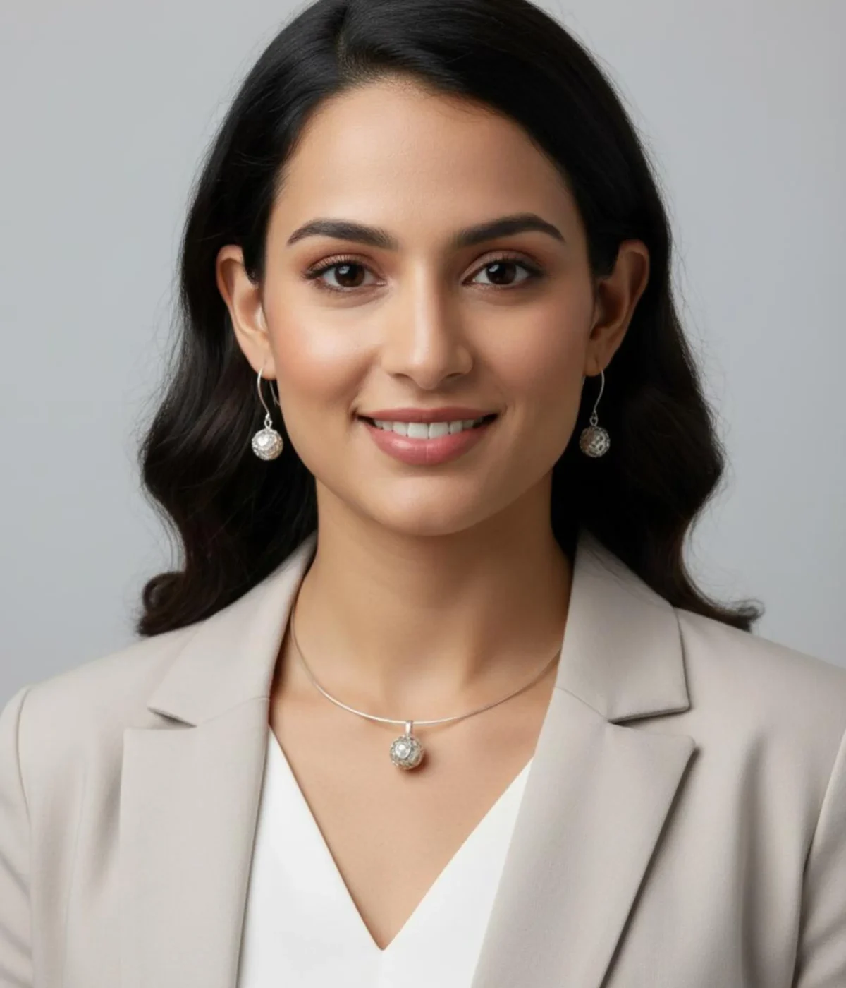 Sterling Silver Filigree Collar Necklace and Drop Earring Set. Features a sleek silver band and unique mesh ball pendant and earrings. Displayed on a carved wooden box.
