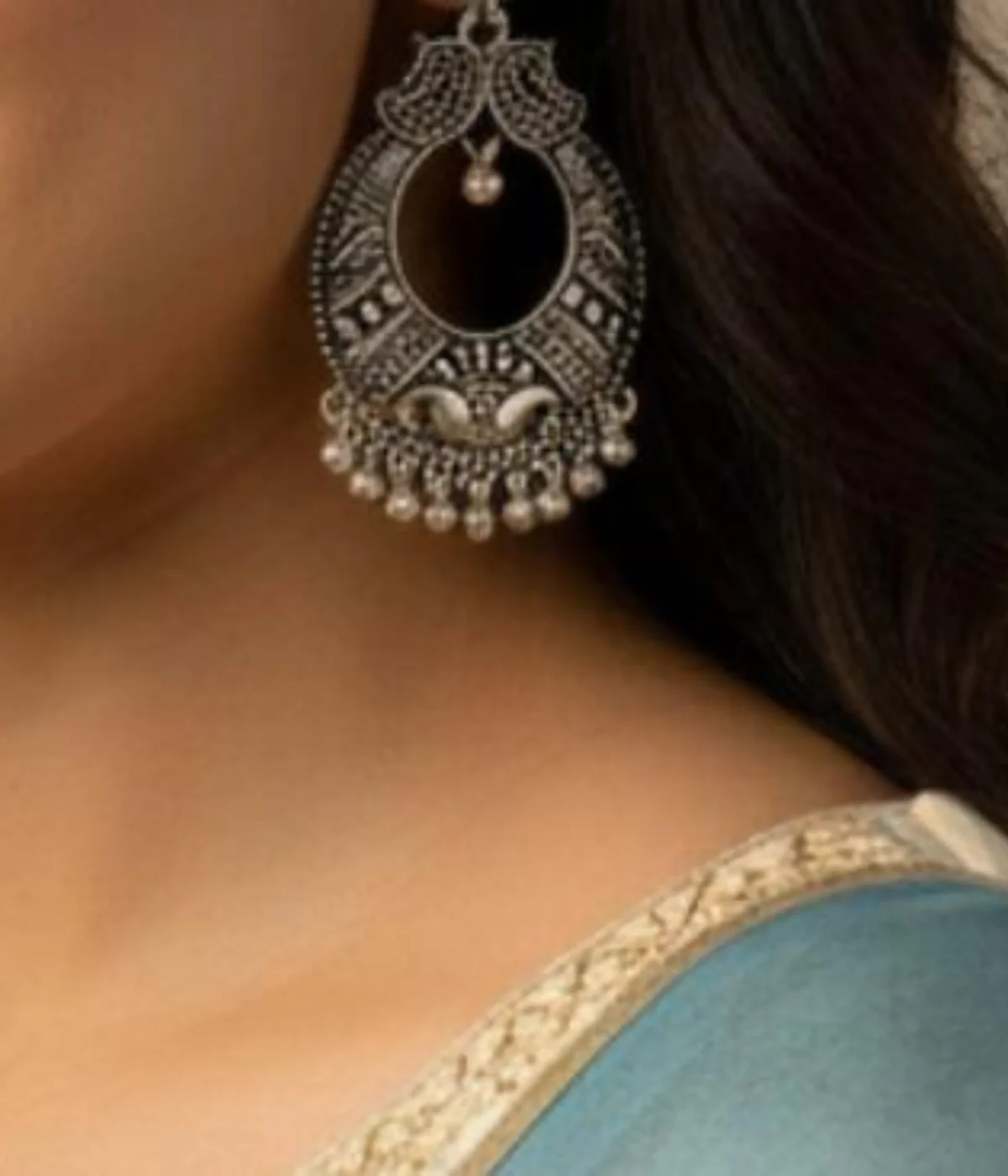 Pair of Oxidized Silver Peacock Drop Earrings. Large Traditional Chandbali Jhumka style with intricate ghungroo drops and tribal carving, displayed inside a velvet-lined wooden jewelry box.