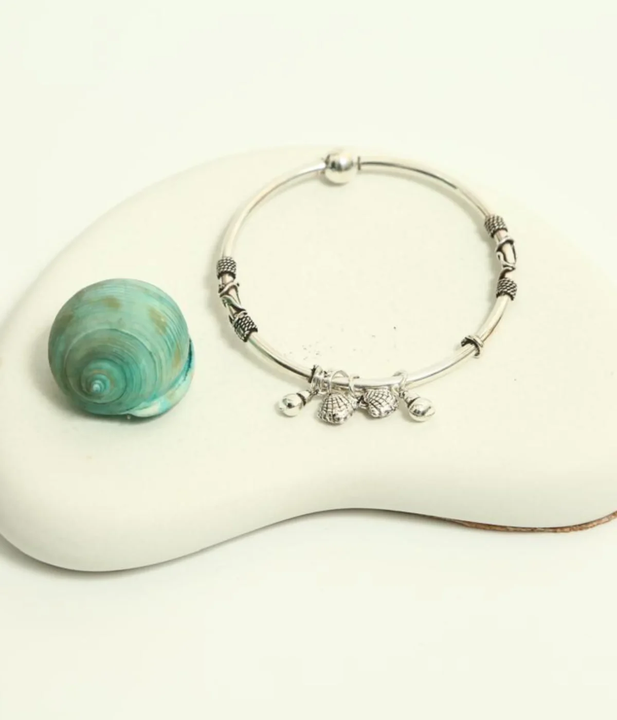 925 Sterling Silver Ghungroo Bangle | Oxidized Tribal Charm Bracelet with jingle bells on a dark blue background.