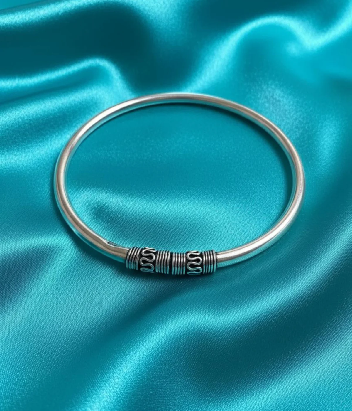 Solid Sterling Silver Lock Bangle with a smooth band. Features decorative, oxidized wirework cylinders at the pin closure. Traditional Tribal Kada for daily wear.