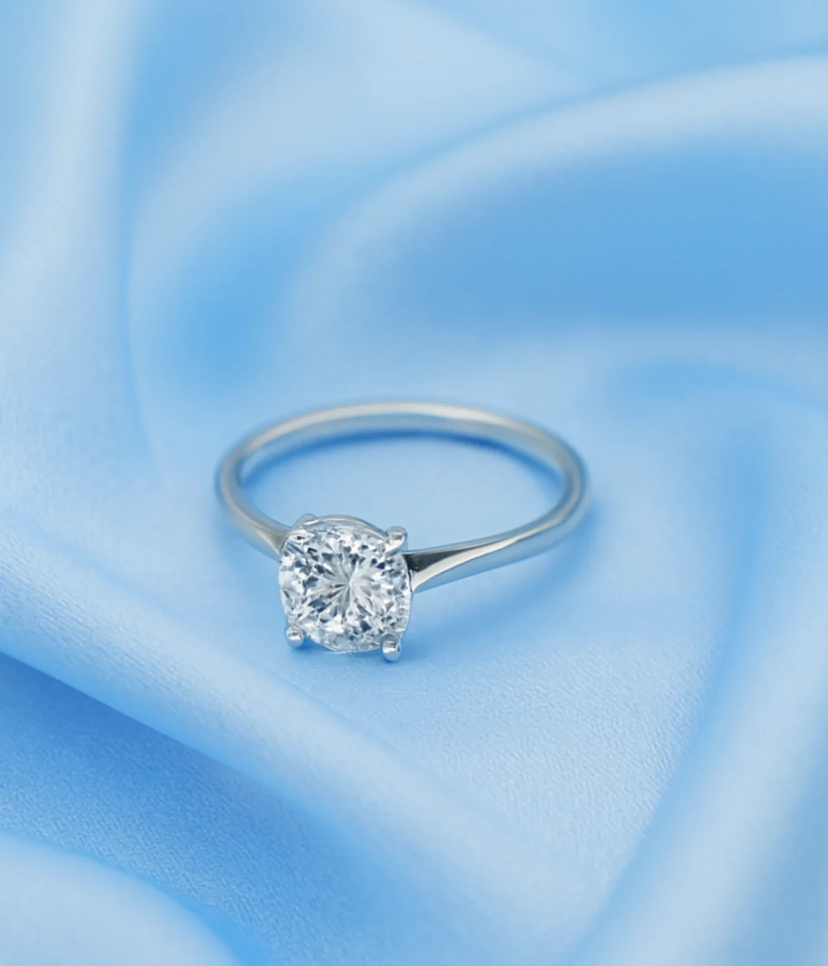 Sterling Silver Solitaire Ring. Classic design with a brilliant Round CZ center stone and Pave accent stones on the band. Ideal Engagement or Promise Ring.