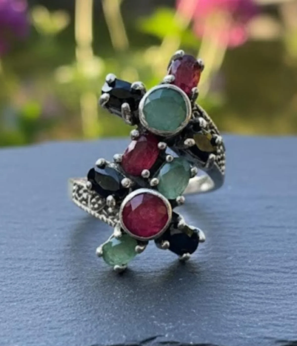 Oxidized Sterling Silver Multi-Gemstone Statement Ring. Features a Tri-Color cluster of Ruby, Emerald, and Black Onyx stones in a vintage-style criss-cross design. Cocktail Ring jewelry.
