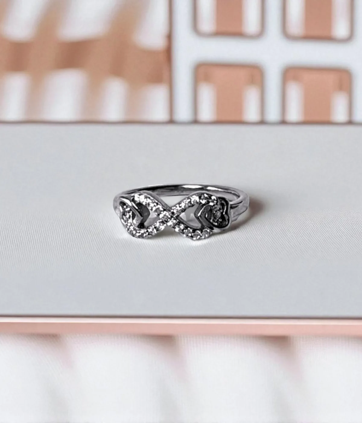 Sterling Silver Infinity Ring. Elegant Pave CZ design forming the forever love symbol (figure-eight). Dainty promise ring or everyday jewelry.