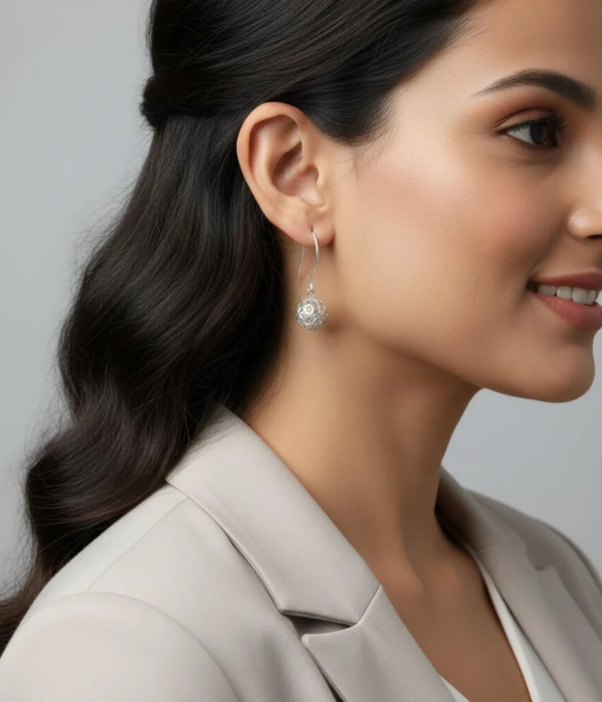 Sterling Silver Filigree Collar Necklace and Drop Earring Set. Features a sleek silver band and unique mesh ball pendant and earrings. Displayed on a carved wooden box.