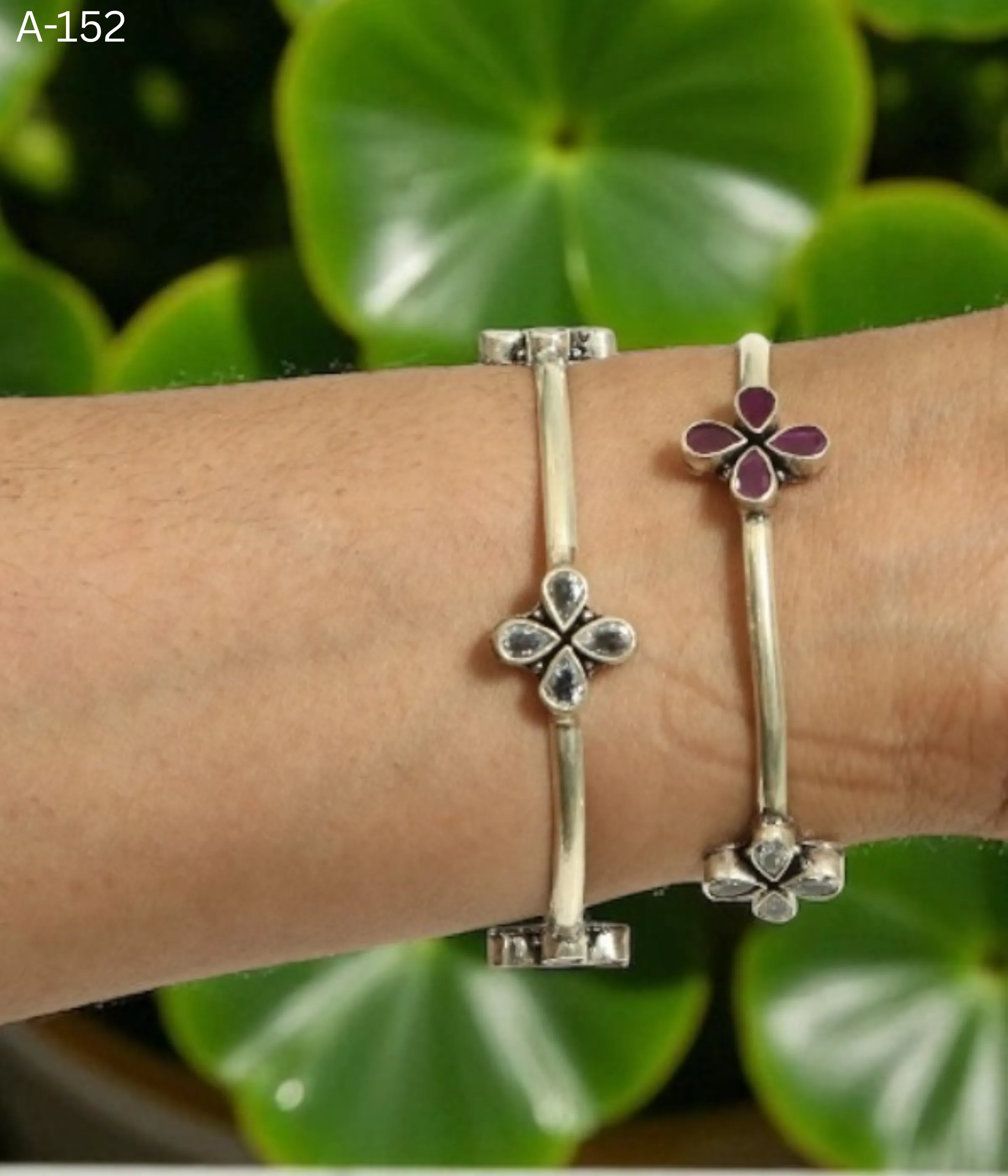 Pair of Sterling Silver Clover Bangle Bracelets. Fixed set with one bangle featuring Ruby/Magenta stones and the second featuring Clear CZ stones. Two-Tone Minimalist Kada Set.