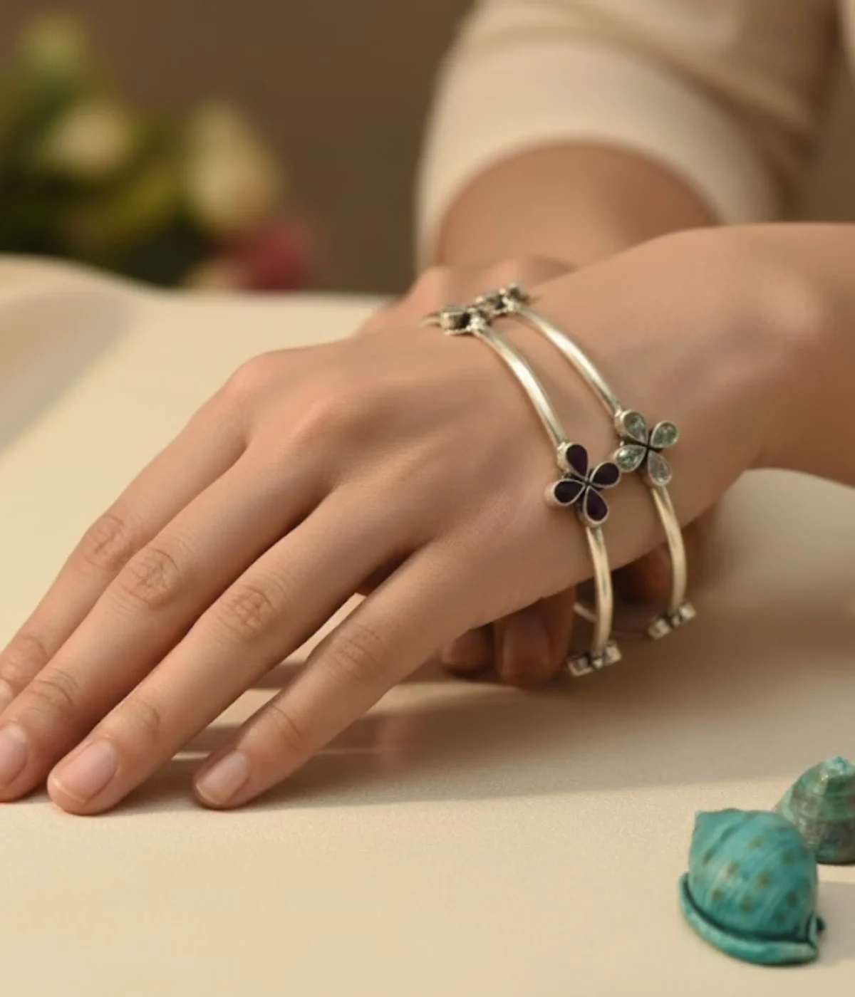 Pair of Sterling Silver Clover Bangle Bracelets. Fixed set with one bangle featuring Ruby/Magenta stones and the second featuring Clear CZ stones. Two-Tone Minimalist Kada Set.