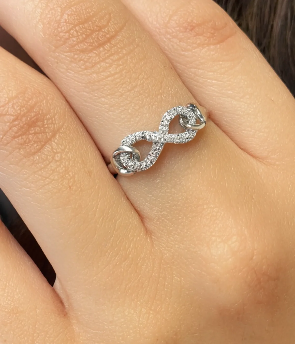 Sterling Silver Infinity Ring. Elegant Pave CZ design forming the forever love symbol (figure-eight). Dainty promise ring or everyday jewelry.