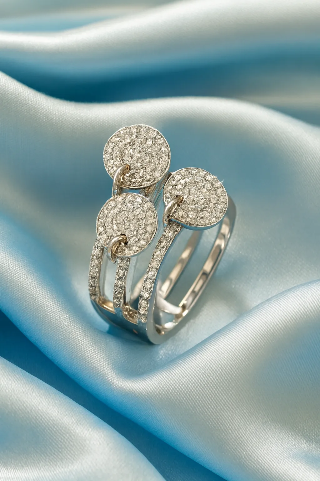 Sterling Silver Multi-Band Ring Set. Features a layered look of pave CZ and polished bands with dangling disc charms. Trendy stackable fashion ring.