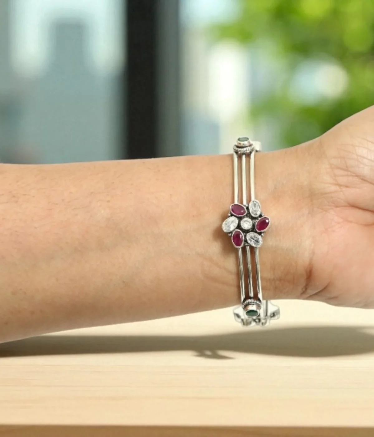 Sterling Silver Multi-Strand Bangle. Features a central Floral motif set with Ruby (maroon) and clear CZ gemstones. Stackable bracelet with a layered design, ideal for daily wear Indian jewelry.