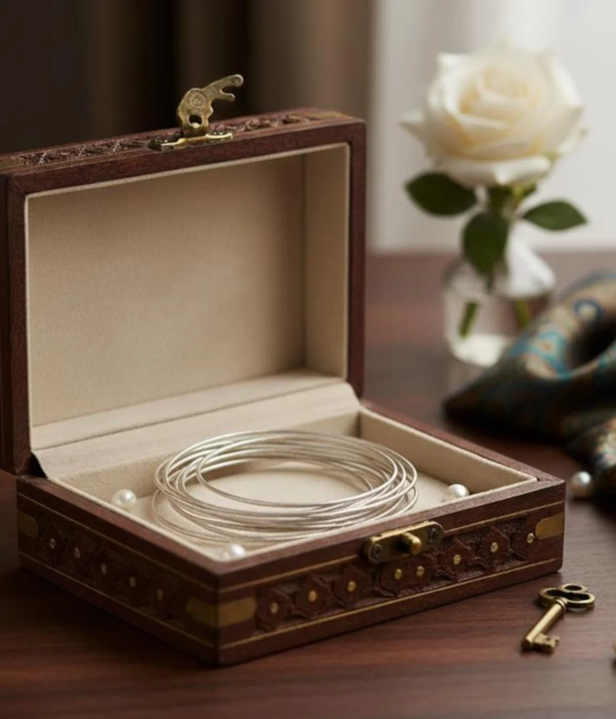 NeerSterling Silver Intertwined Wire Bangle worn on a wrist. 925 Woven statement cuff featuring a 16-in-1 layered abstract design. Unique modern jewelry gift.