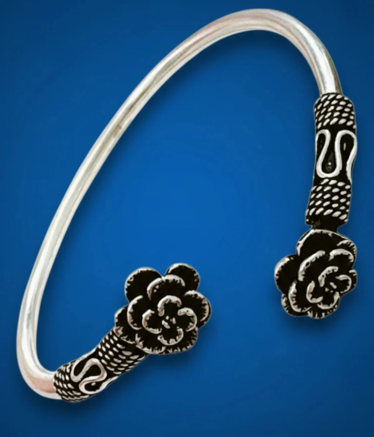 Neersterling Oxidized silver open cuff bangle with detailed floral rose ends.