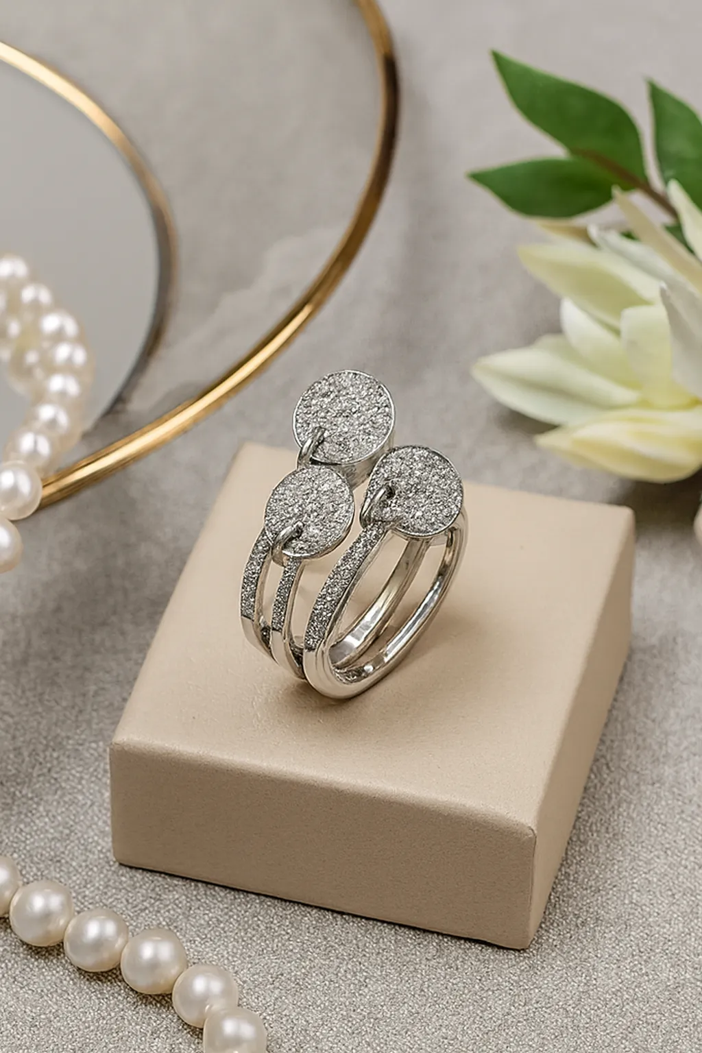 Sterling Silver Multi-Band Ring Set. Features a layered look of pave CZ and polished bands with dangling disc charms. Trendy stackable fashion ring.