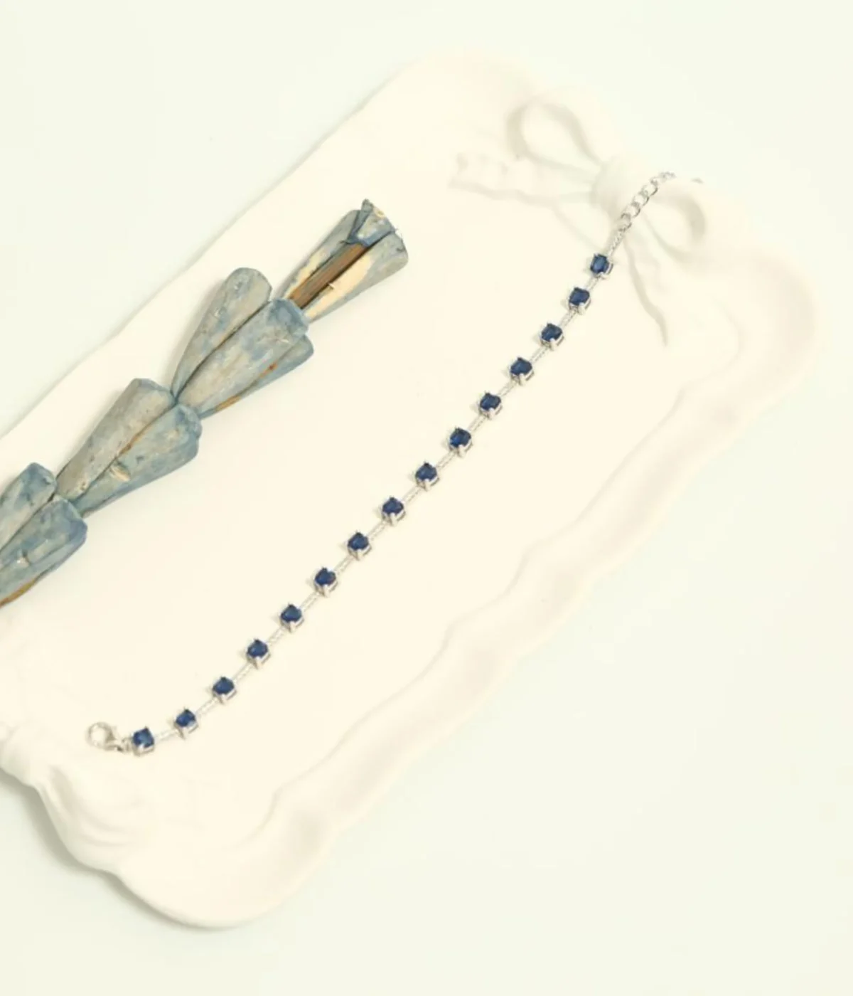 NeerSterling Silver Blue Gemstone Line Bracelet. Dainty 925 silver chain featuring a continuous line of round blue/sapphire-colored solitaire stations. Minimalist stacking jewelry.