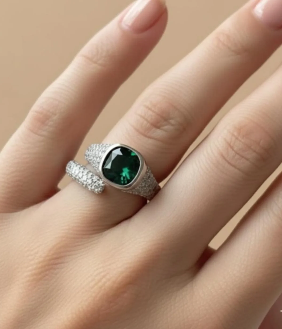 Sterling Silver Green Stone Statement Ring. Features a bold cushion-cut simulated Emerald gem and a dazzling pave CZ open bypass band. Modern Cocktail Ring.