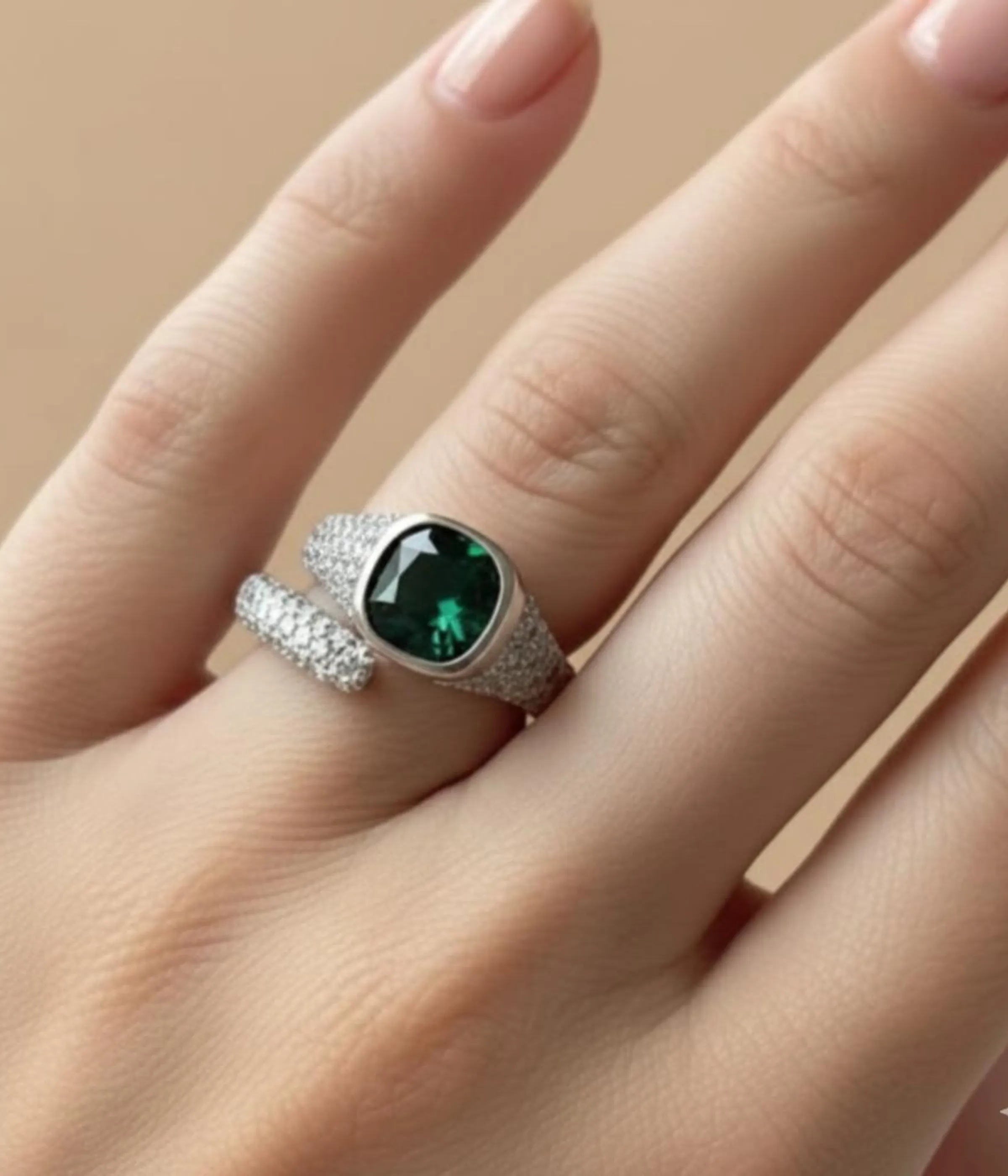 Sterling Silver Green Stone Statement Ring. Features a bold cushion-cut simulated Emerald gem and a dazzling pave CZ open bypass band. Modern Cocktail Ring.