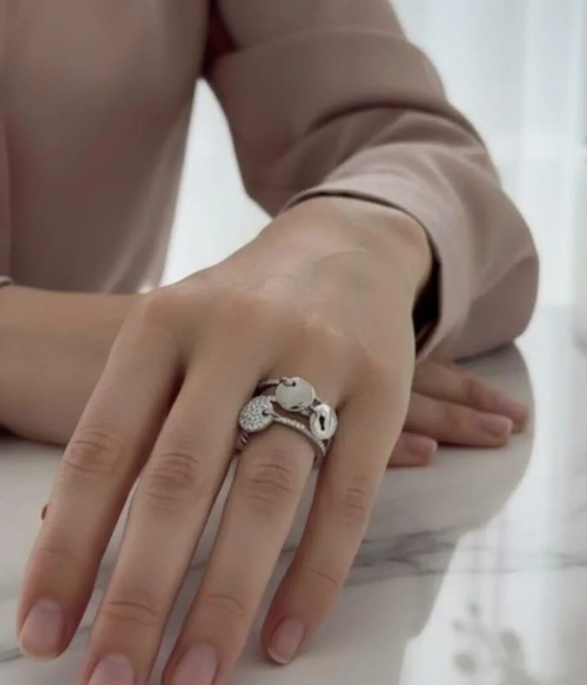 Sterling Silver Multi-Band Ring Set. Features a layered look of pave CZ and polished bands with dangling disc charms. Trendy stackable fashion ring.