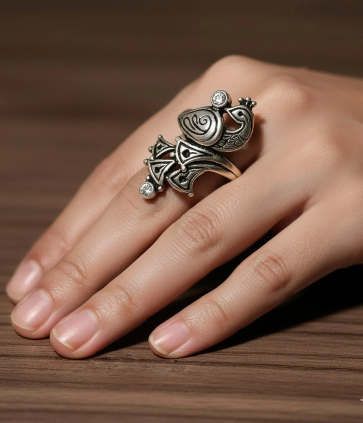 Oxidized Sterling Silver Peacock Ring. Detailed Mayur motif in an ethnic, antique tribal look design with small CZ accents. Traditional statement ring.