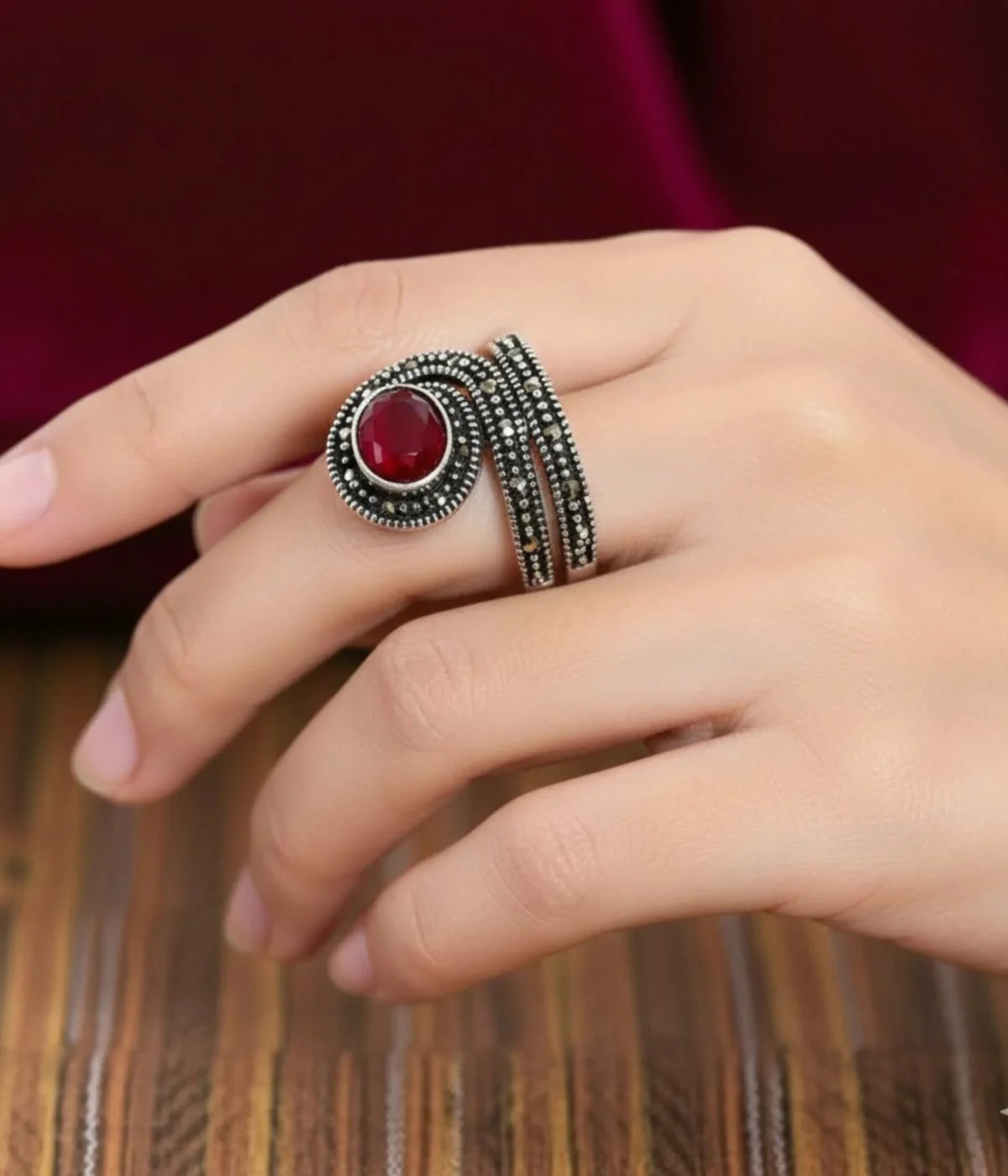 Vintage Marcasite Coil Ring. Oxidized Sterling Silver wrap ring featuring a large faceted Ruby Red center stone and detailed Marcasite accents. Antique Statement Jewelry.
