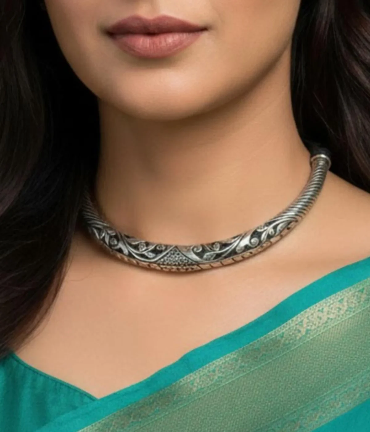 Reversible 925 Silver Hasli Necklace (Choker) with intricate oxidized ethnic carving. Handcrafted, two-in-one silver jewelry displayed on a dark wooden background.