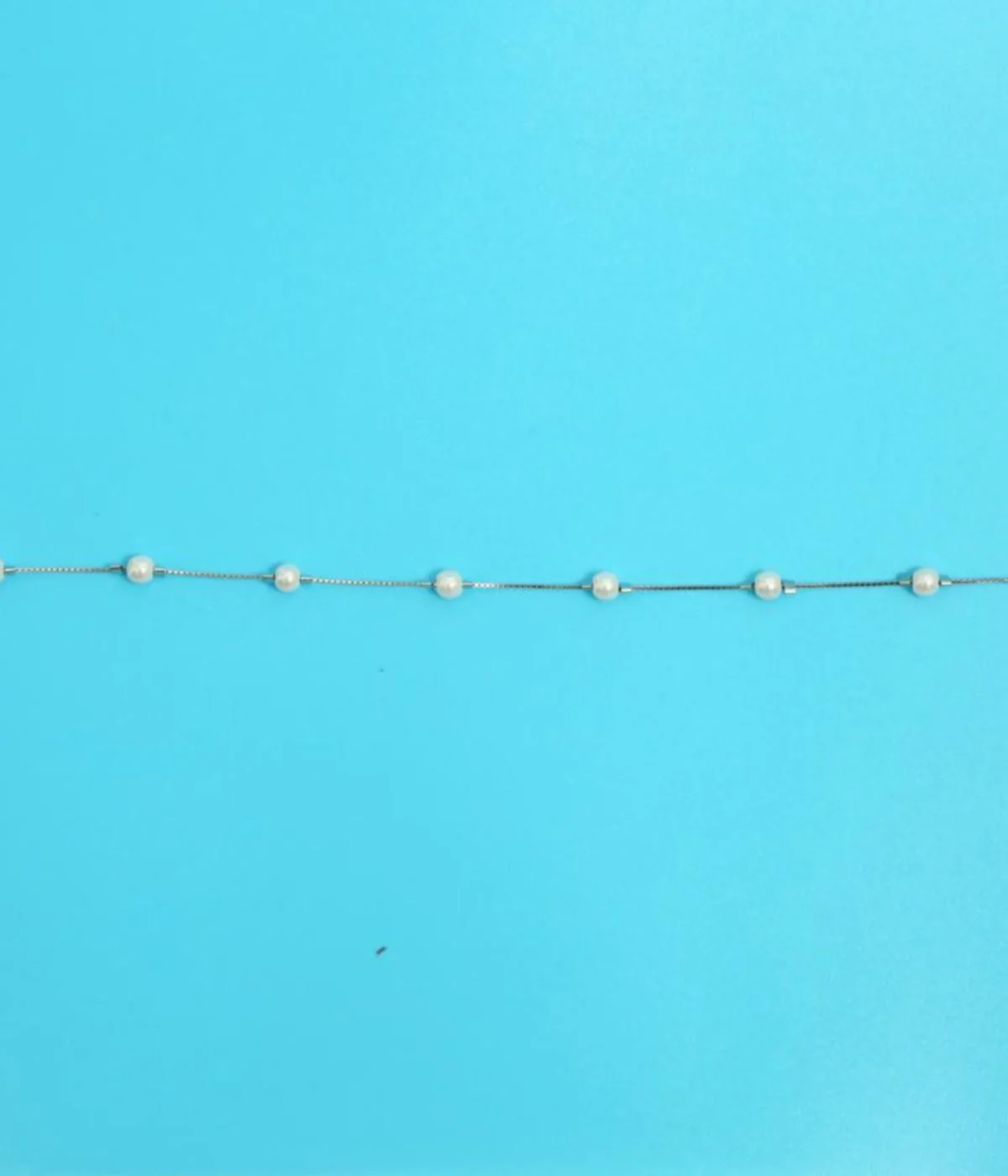 NeerSterling Silver Dainty Floating Pearl Station Bracelet. Minimalist 925 silver chain featuring evenly spaced freshwater pearls. Elegant stacking jewelry (consider 4 quantity for layering).