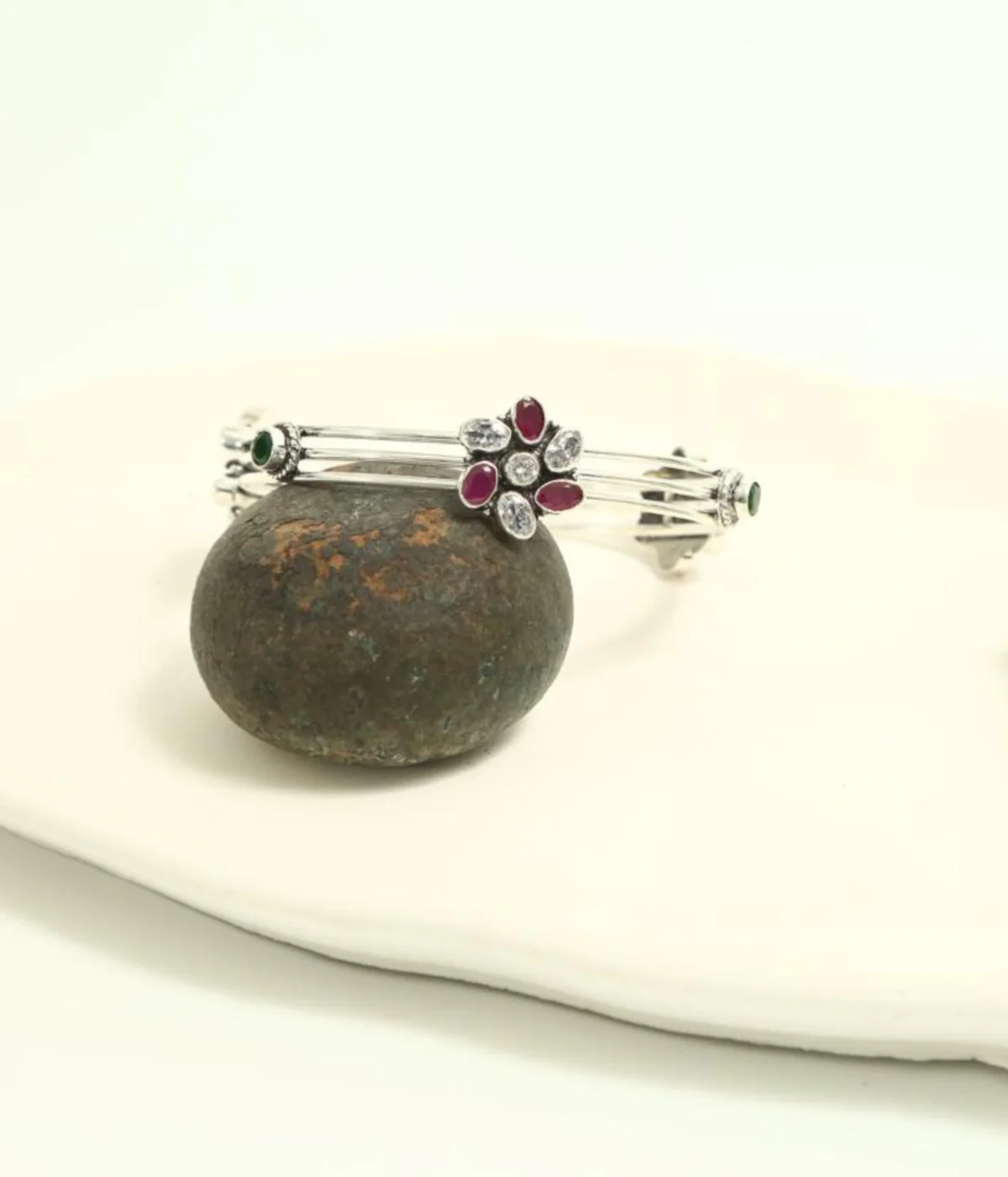 Sterling Silver Multi-Strand Bangle. Features a central Floral motif set with Ruby (maroon) and clear CZ gemstones. Stackable bracelet with a layered design, ideal for daily wear Indian jewelry.