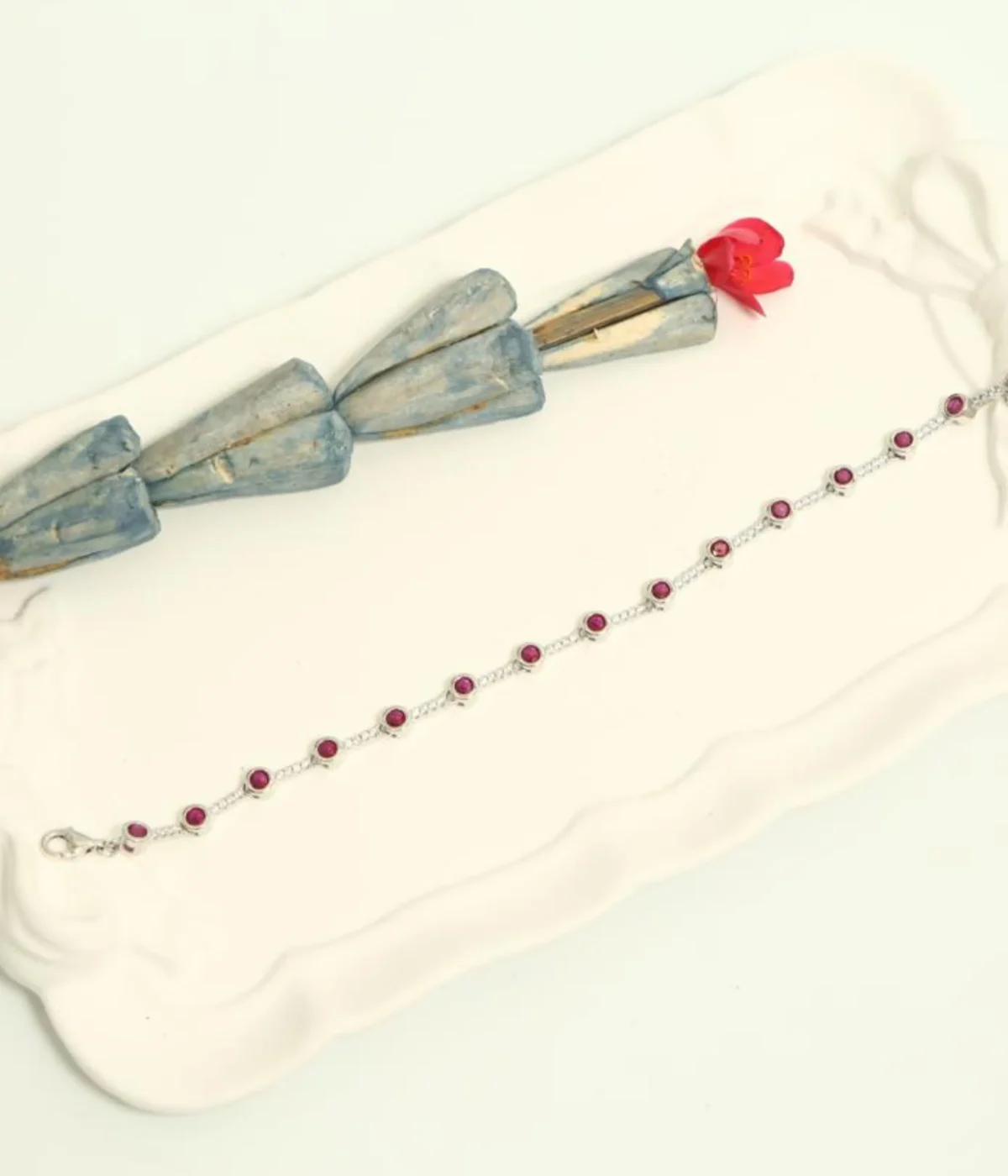 Sterling Silver Pink Gemstone Line Bracelet with round solitaire stations. Dainty 925 silver chain featuring evenly spaced pink/ruby-colored stones. Minimalist stacking bracelet.