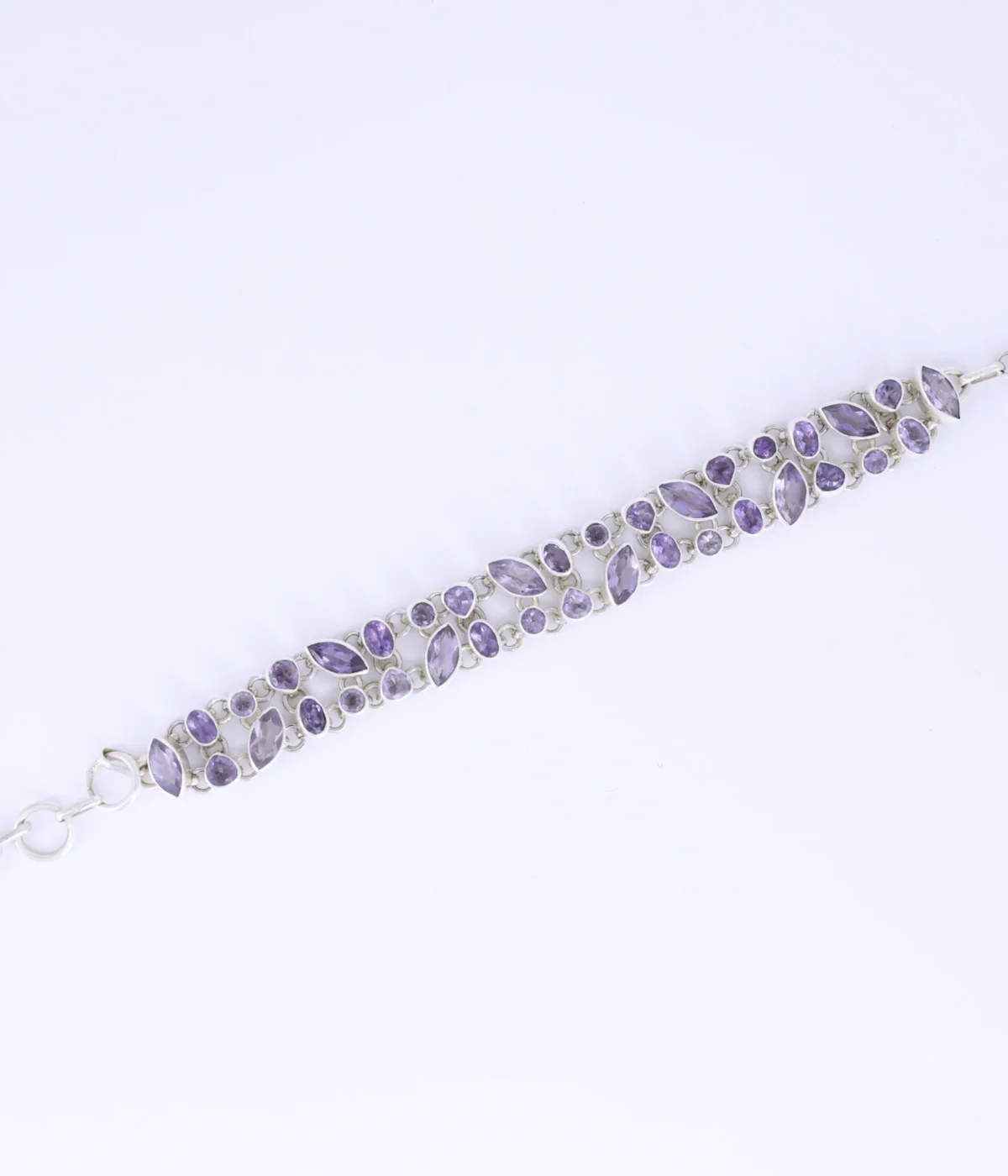 NeerSterling Silver Amethyst Link Bracelet featuring a double row cluster of marquise and round purple gemstones. Elegant 925 silver statement jewelry for women.