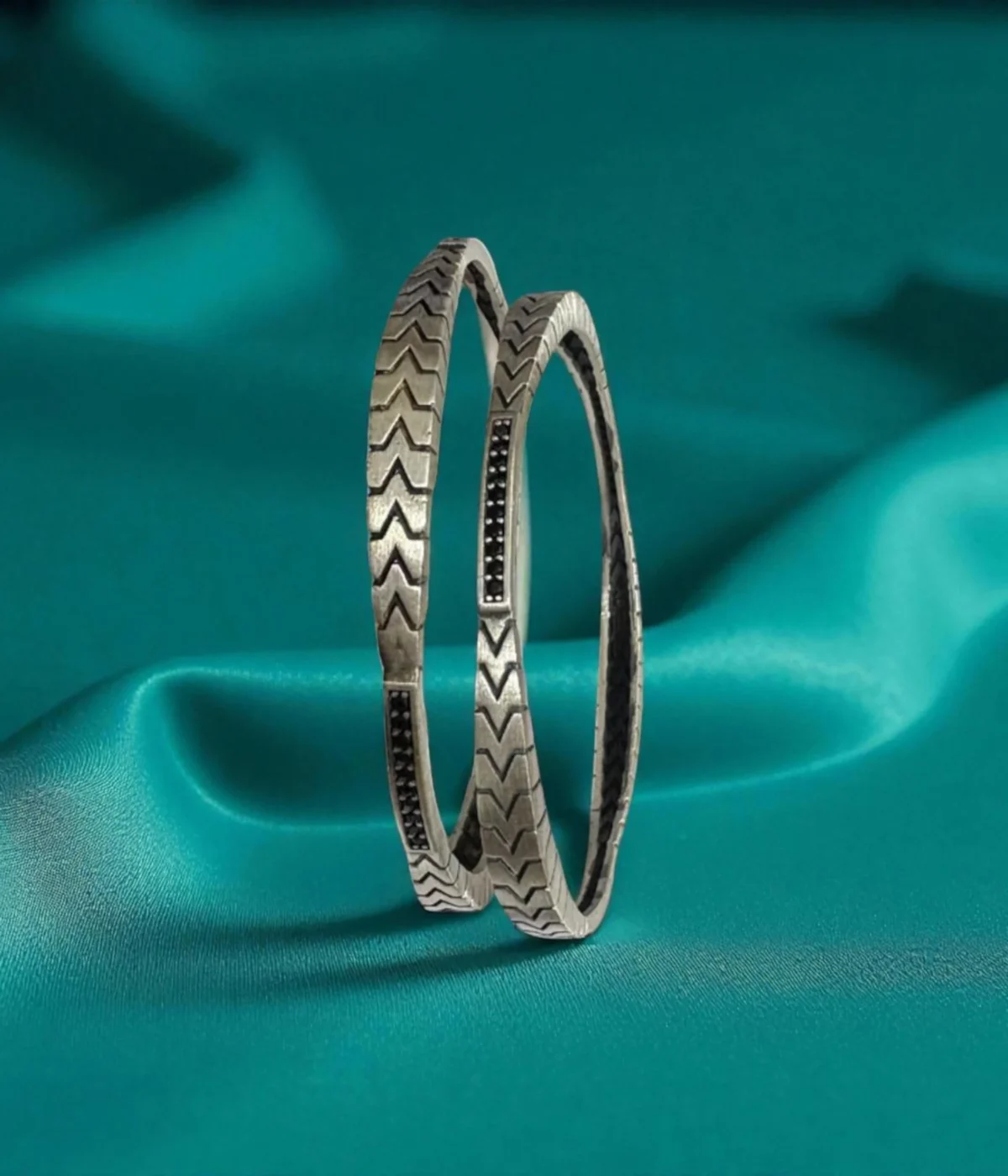 Set of 2 Oxidized Sterling Silver Stackable Bangles featuring a bold geometric chevron pattern and black accents. Vintage tribal jewelry gift in 925 silver.