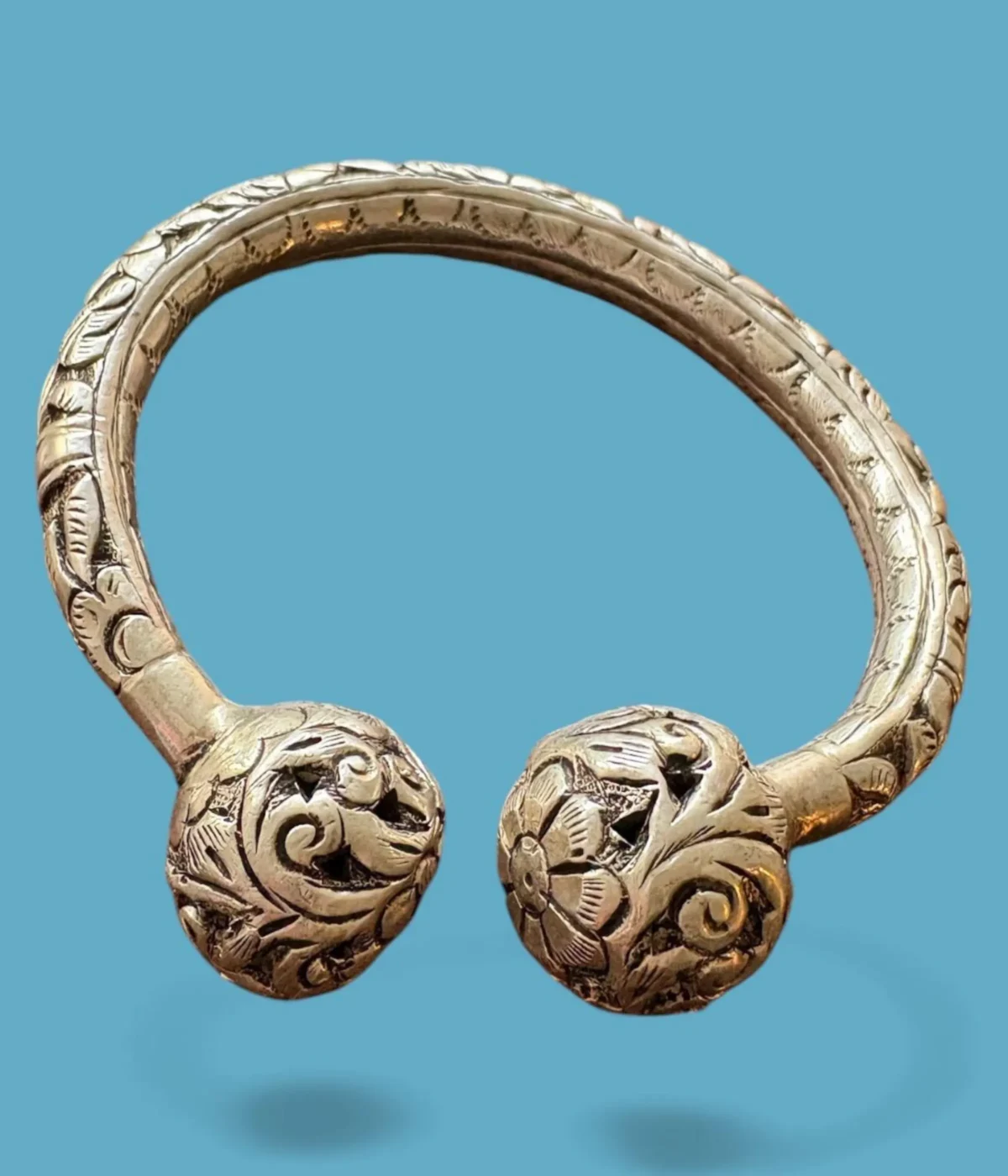Heavy Oxidized Sterling Silver Open Cuff Bangle. Features deep floral carving and large ornate ball finials. Tribal Indian Kada jewelry with an antique silver finish.