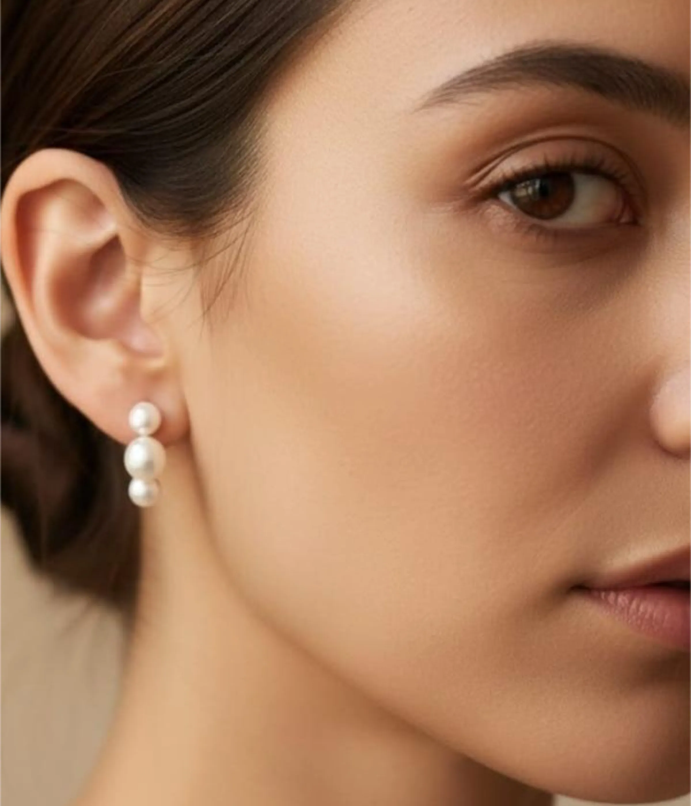 Pair of Minimalist Pearl Cluster Stud Earrings (1 gm). Features a Silver Trio Bubble Design of three small pearls, displayed on a white marble slab with a matching pearl ring and a blue background.