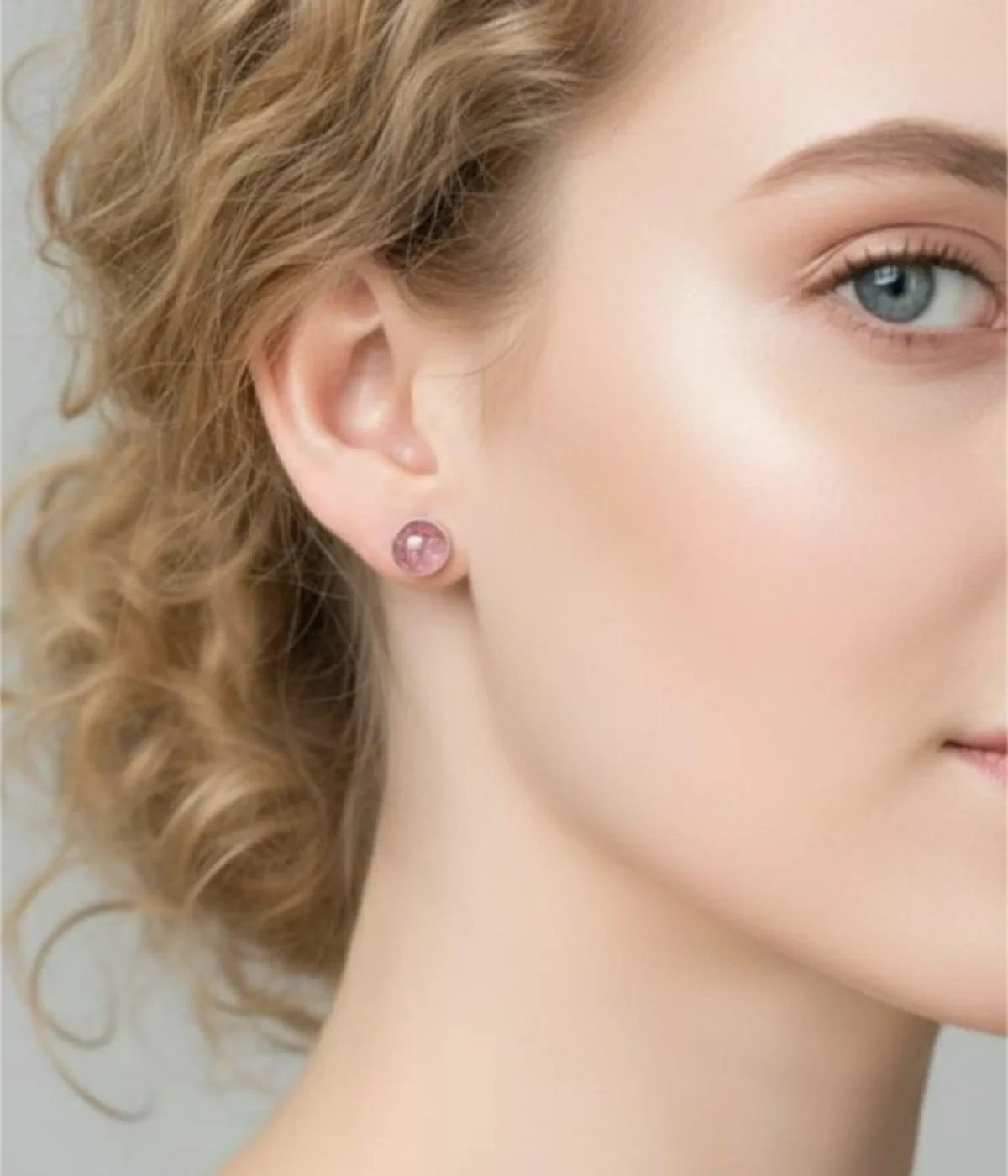 Pair of Curved Pearl Cluster Stud Earrings (1 gm) with three pearls each. Features a Minimalist Ear Climber Design and a clear plastic post back closure, shown on a brown wooden background.