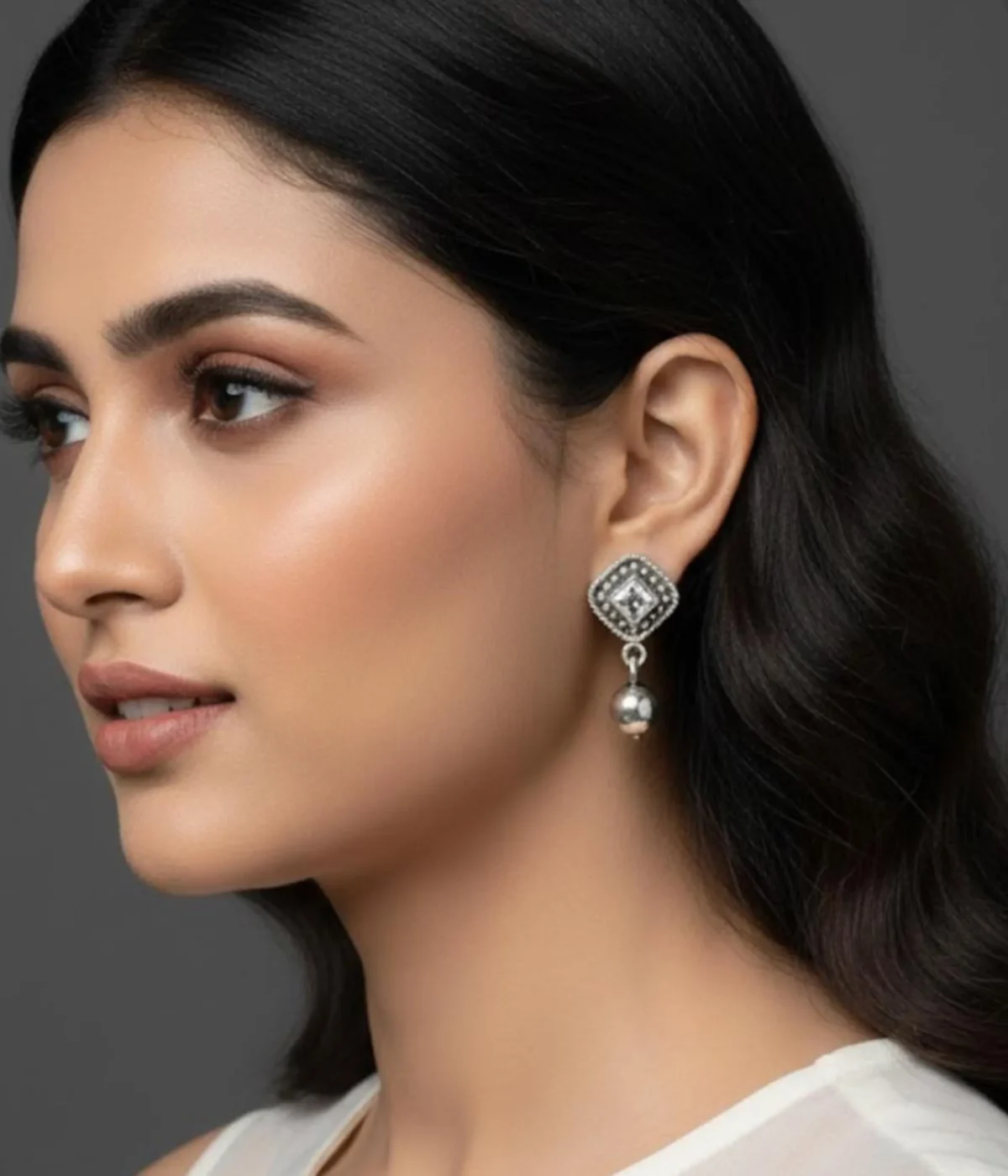 Pair of Oxidized Stud Drop Earrings (6.7 gm). Vintage style silver tone jewelry featuring a central Clear CZ Stone and silver bead dangle, displayed in a red velvet-lined wooden gift box.