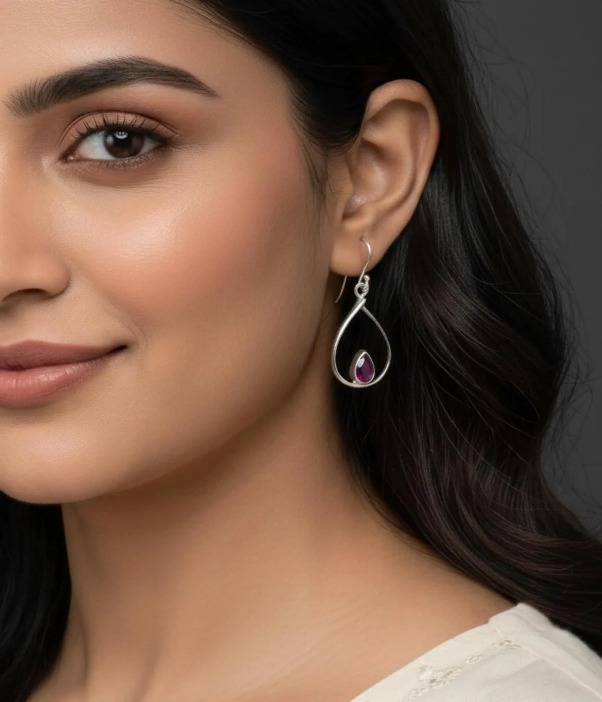 Pair of Minimalist Ruby Teardrop Hook Earrings (3.5 gm). Simple Sterling Silver dangles featuring a Pink Stone accent, presented in an open dark wood jewelry gift box.