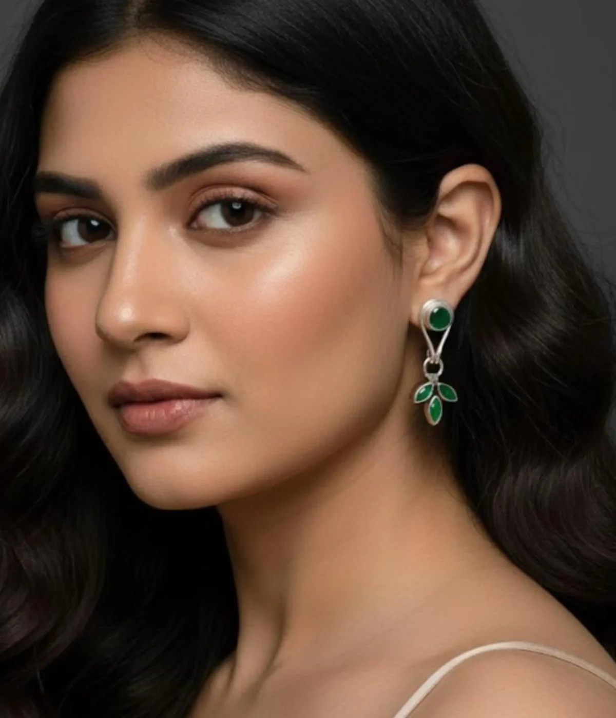 Pair of Minimalist Silver Leaf Drop Earrings (4.15 gm). Nature-inspired design featuring a Green Emerald Stone stud and a three-leaf dangle.