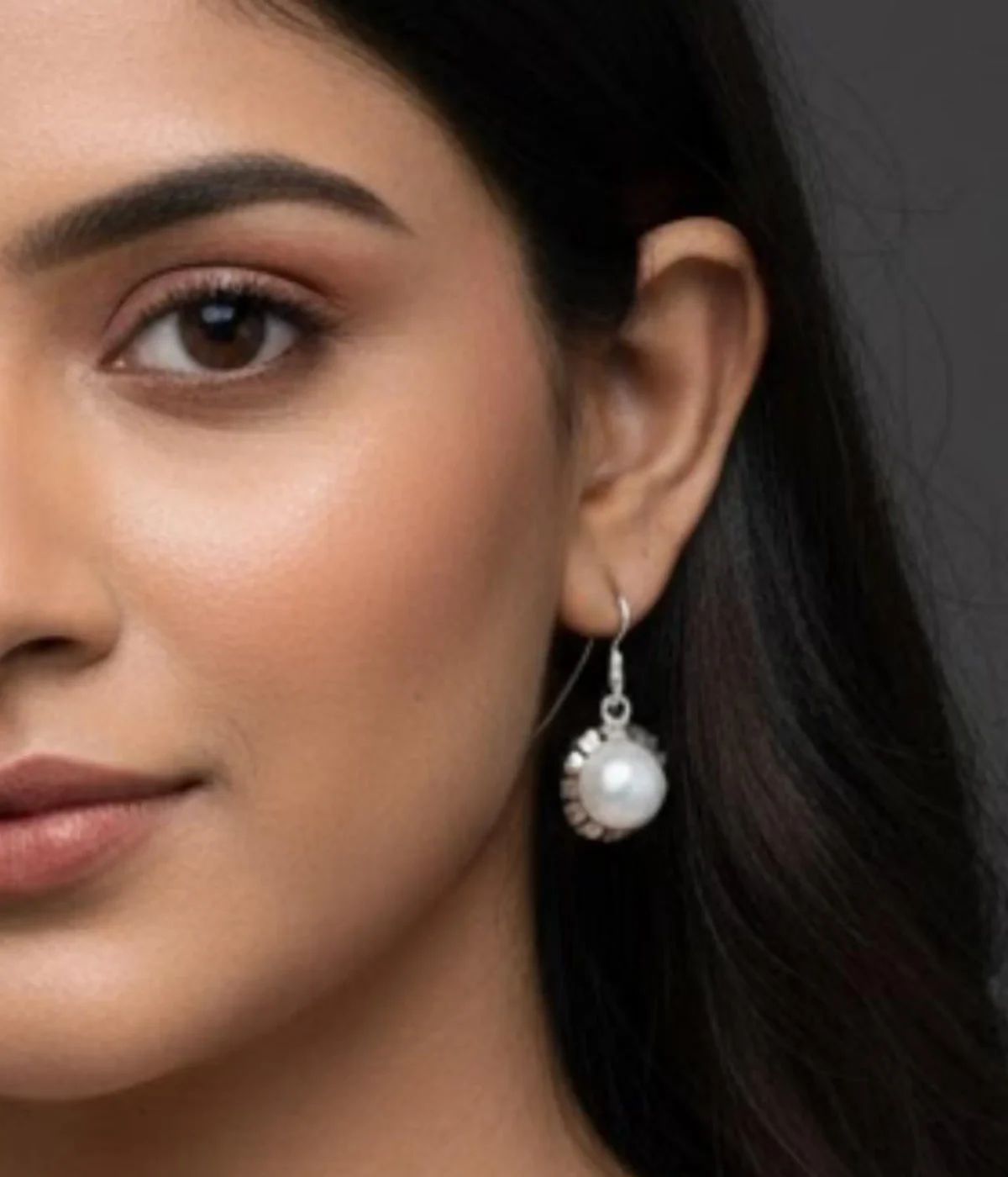 Pair of Vintage Style Pearl Drop Earrings (2.7 gm). Round pearl set in an ornate silver bezel, displayed on a red velvet stand inside a wooden gift box.