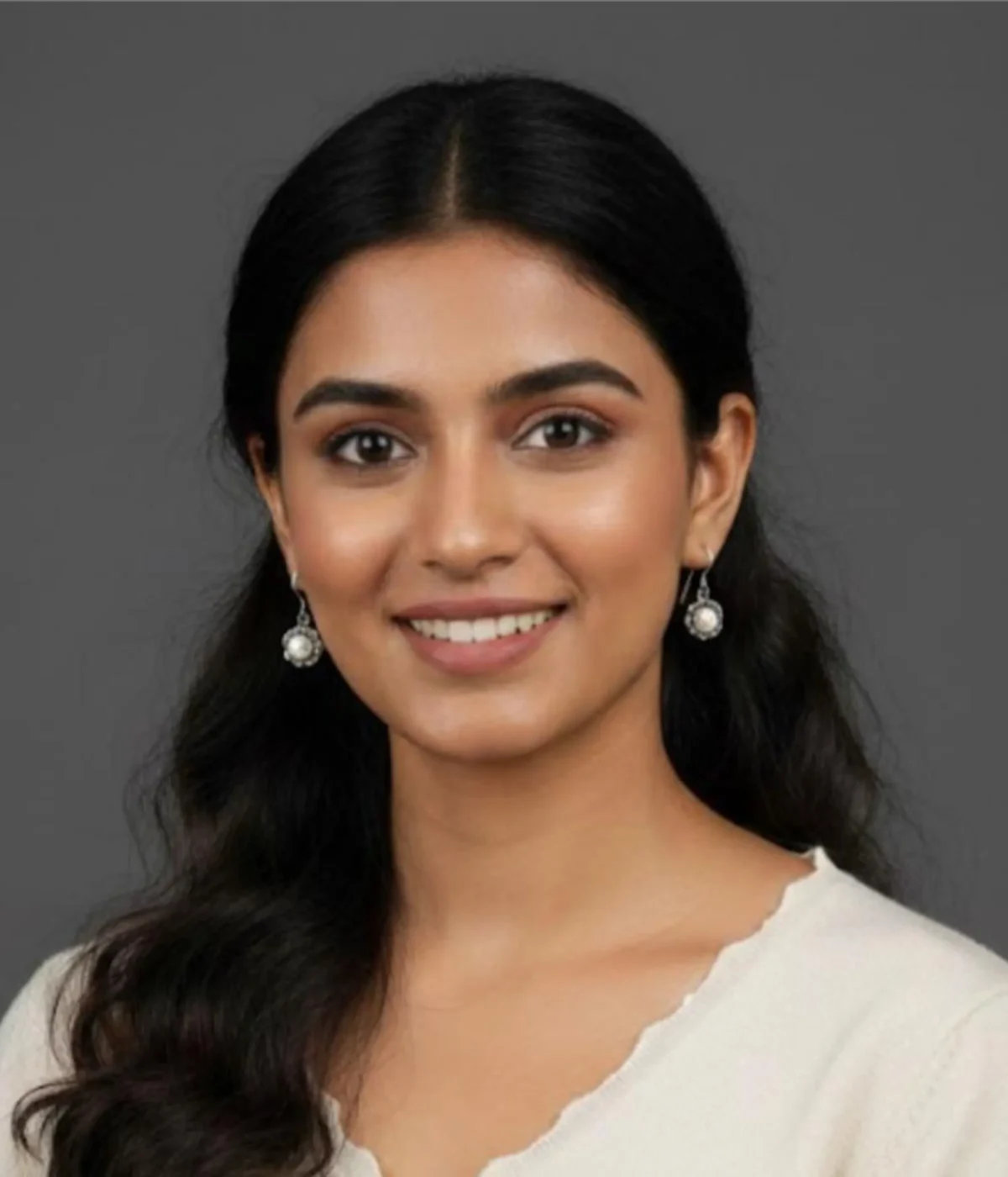 Pair of Dainty Flower Pearl Drop Earrings (2.3 gm). Features a white pearl set in a silver floral frame on secure hooks, displayed on a red velvet stand inside a dark wood gift box.