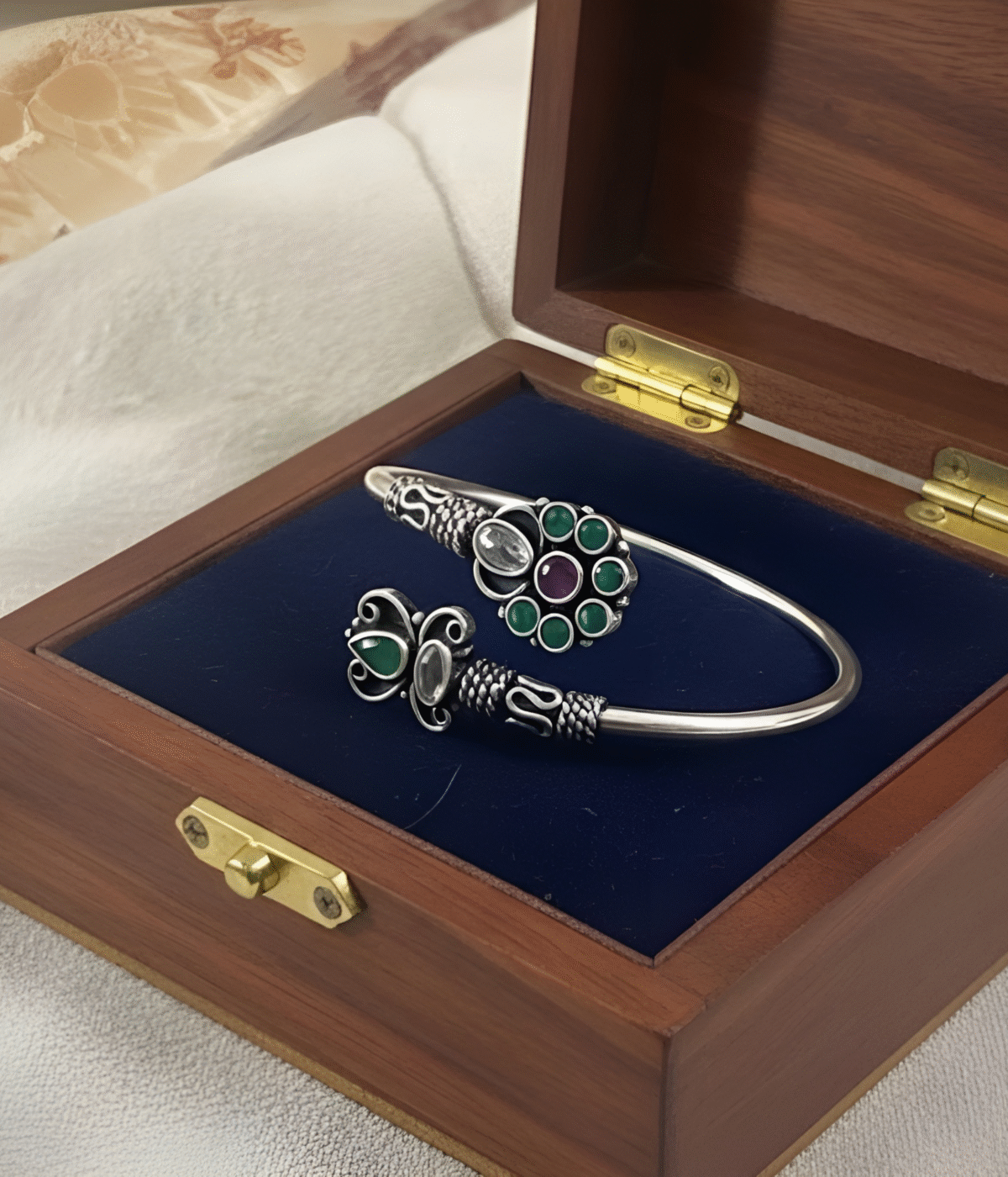 Handcrafted oxidized silver floral bracelet weighing 16.3 grams with green and maroon stone accents in a traditional Indian Kada style