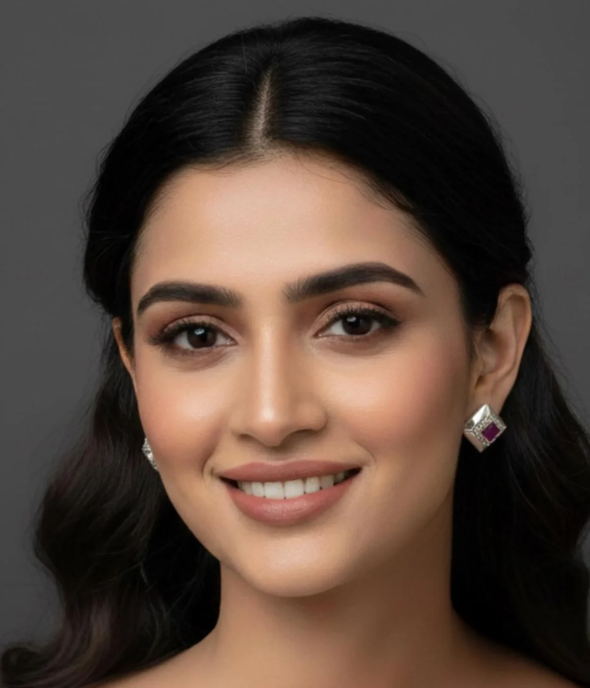 Pair of Oxidized Square Stud Earrings (5.7 gm). Vintage geometric style jewelry with a central Ruby CZ Stone and small clear accents, displayed in an open dark wood box with red velvet lining.