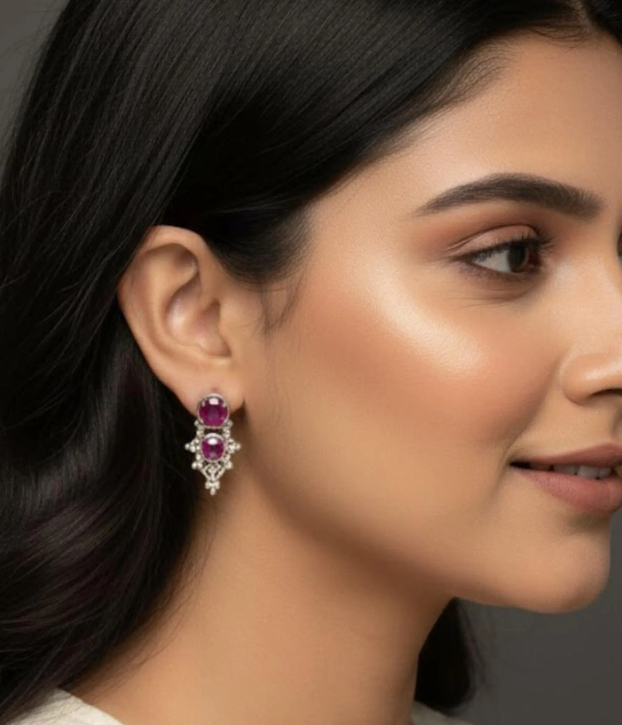 Pair of Oxidized Silver Stud Earrings. Ethnic ruby stone cluster design with intricate detailing, displayed in an open light wood jewelry gift box.