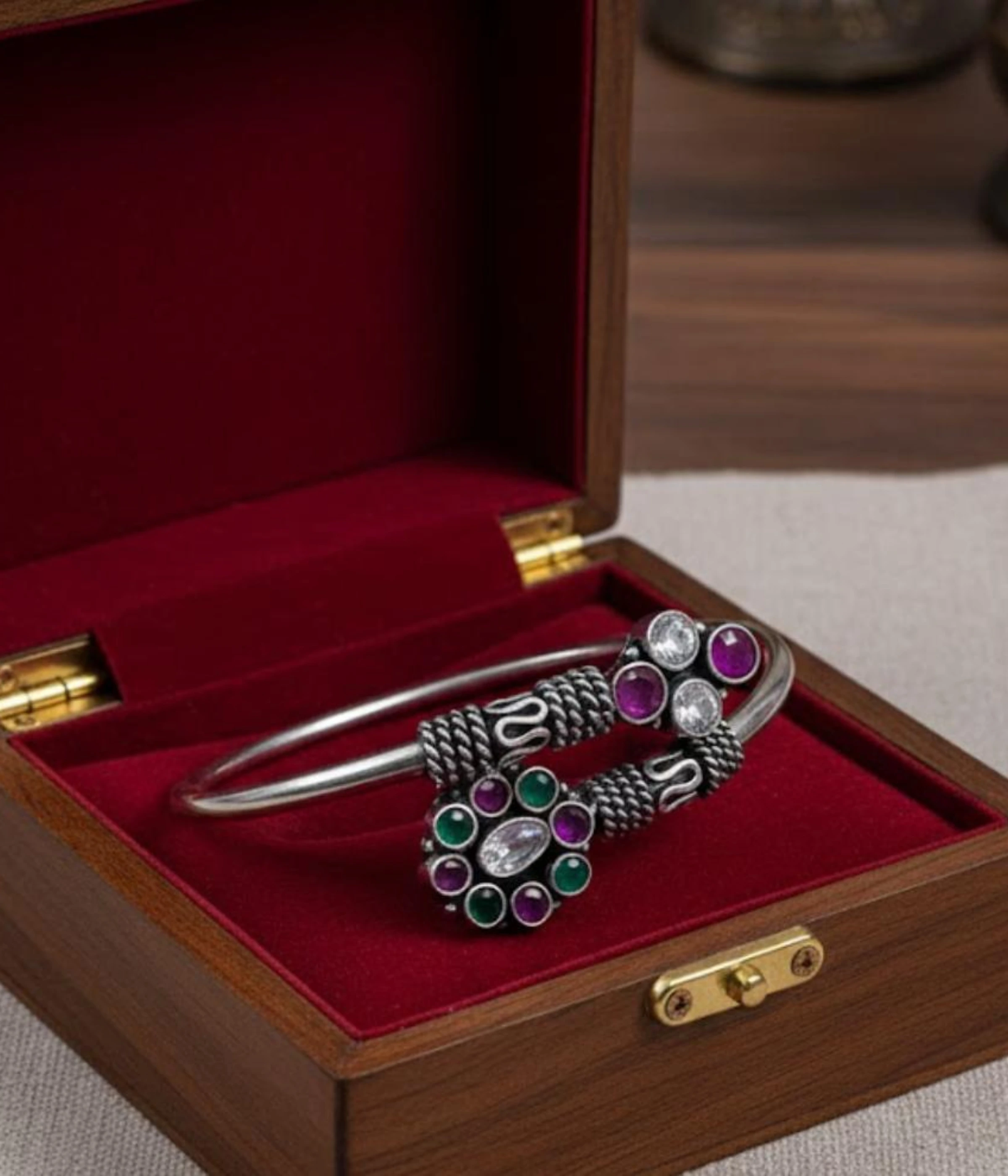 Handcrafted 17.1 gm oxidized silver floral stone bracelet featuring a vibrant emerald green and ruby maroon dual-flower design